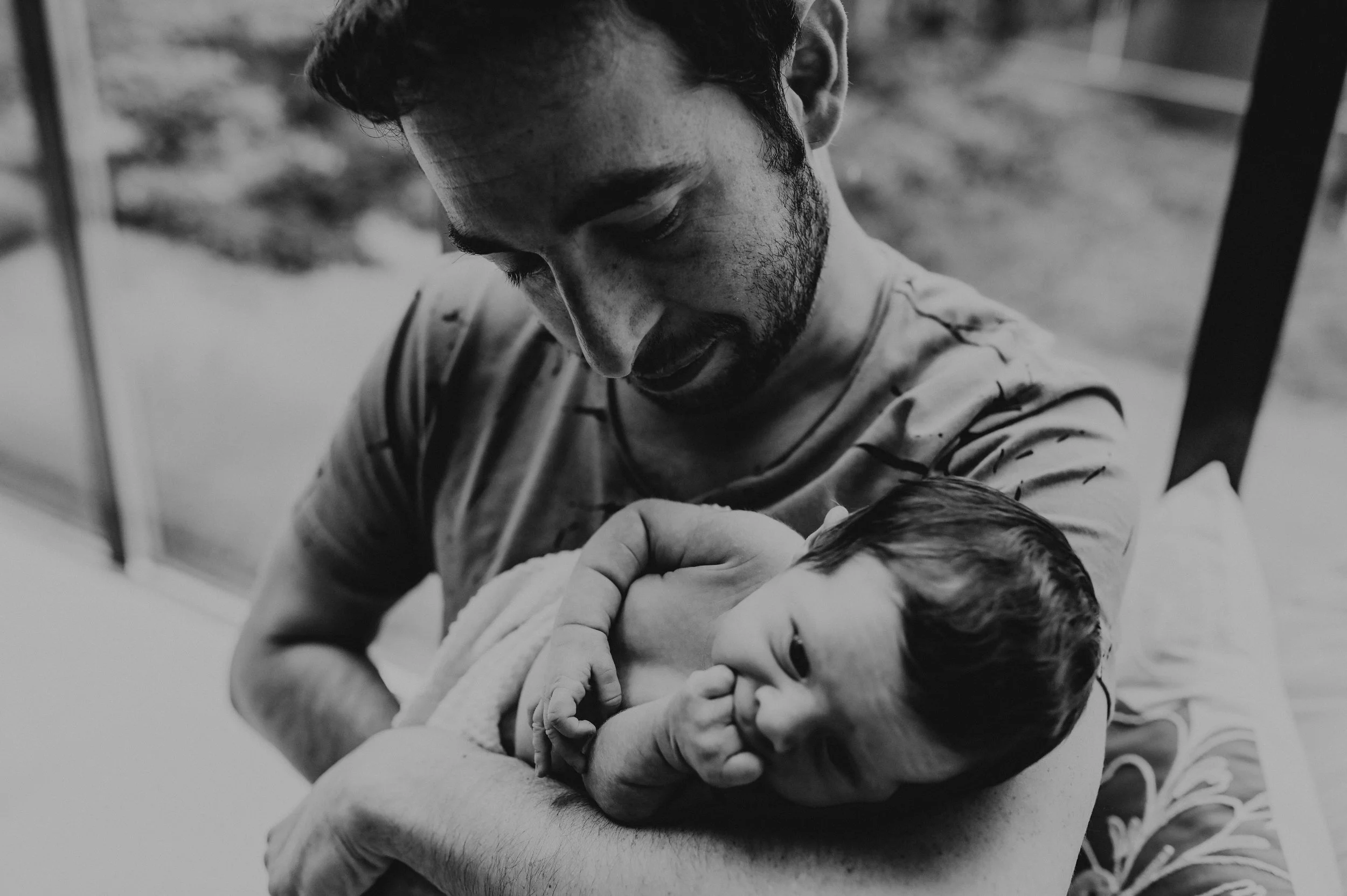 baby and dad sitting in window