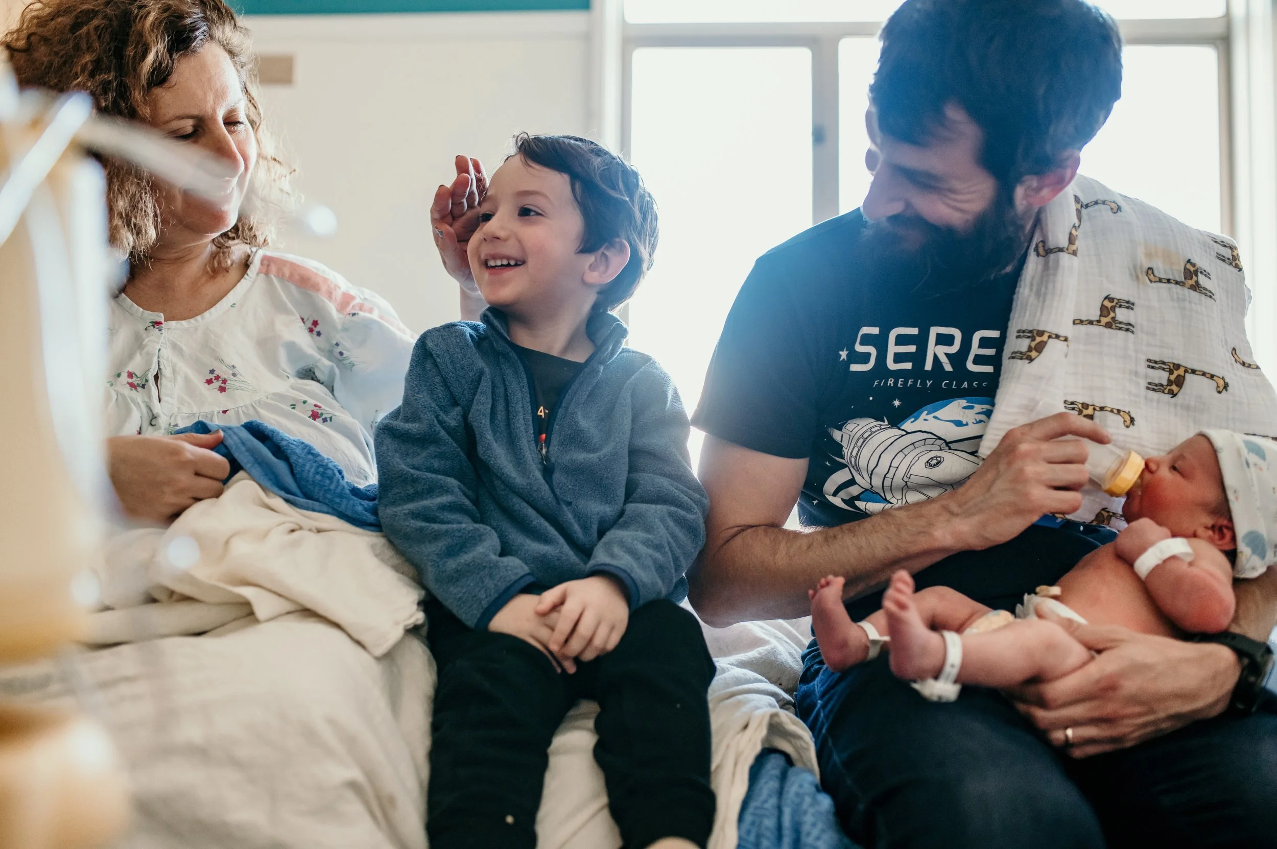 family at newborn hospital photo session 