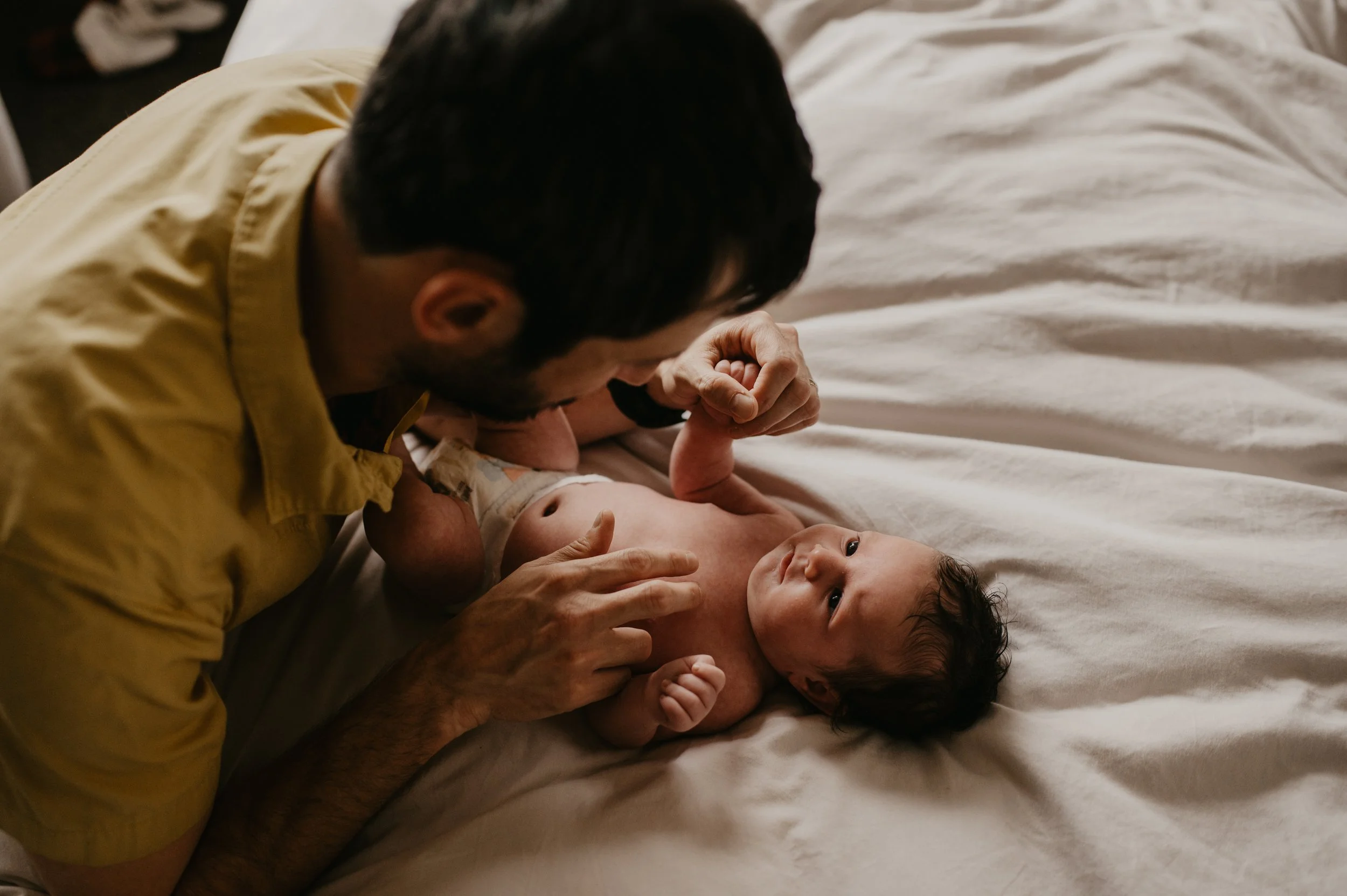 dad and baby in home newborn session 