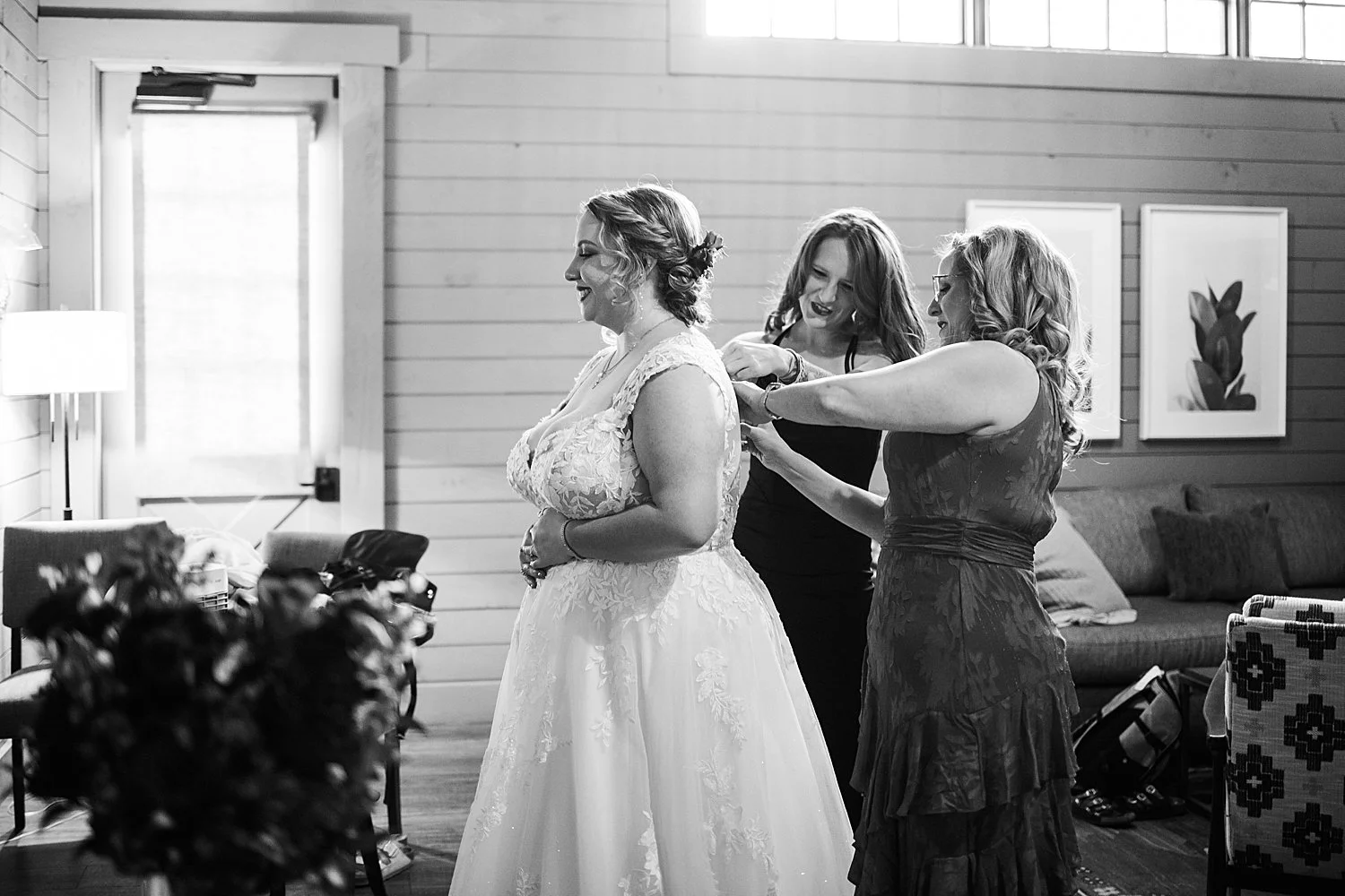 woman gets ready for her big day with help from friends by Dripping Springs wedding photographer