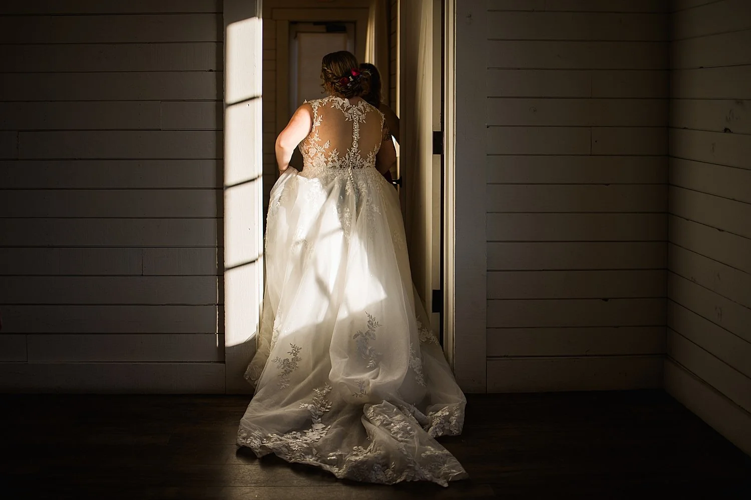 brides follow each other down the hallway at Morgan Creek venue