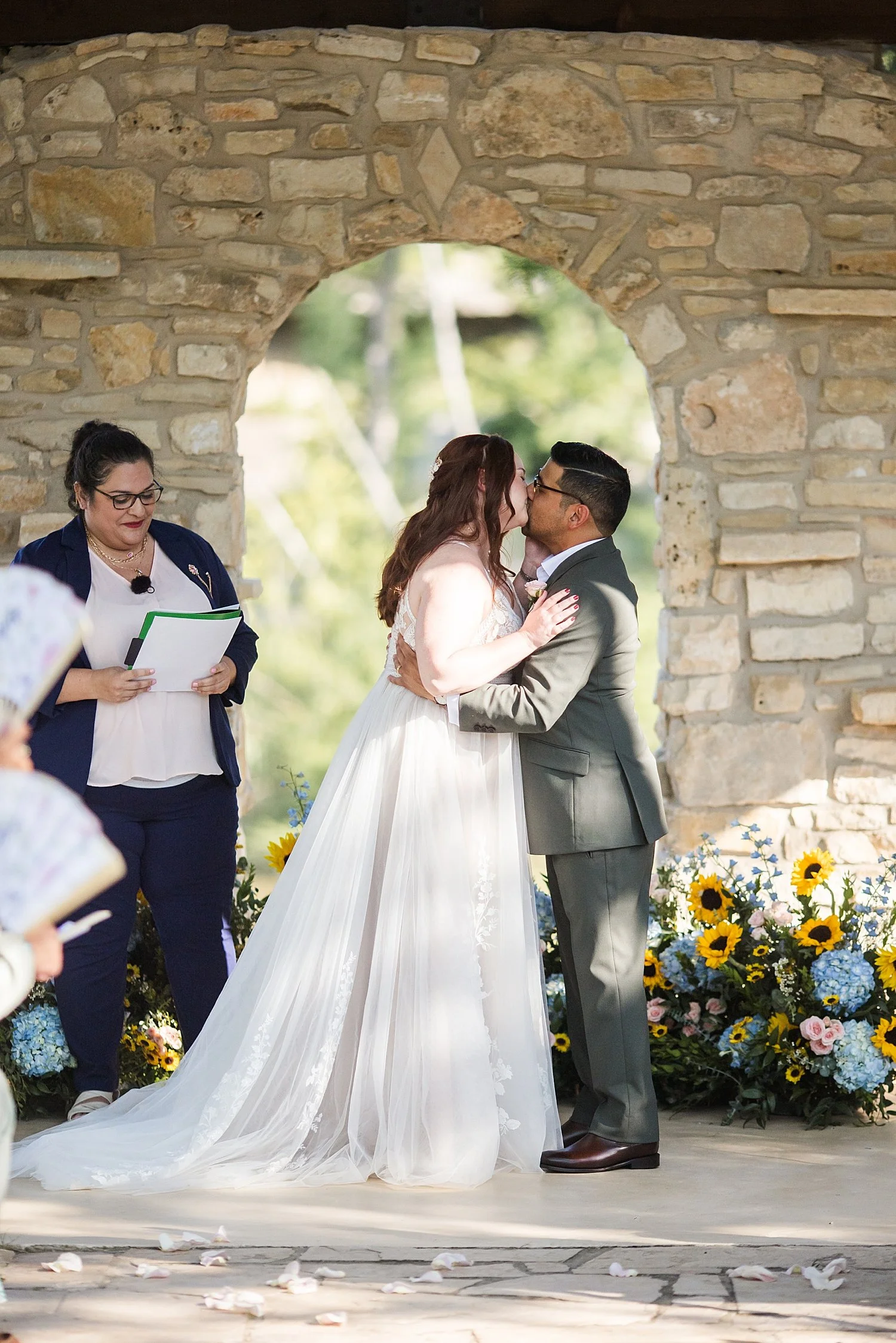 couple shares a first kiss at their ceremony at The Waters Point