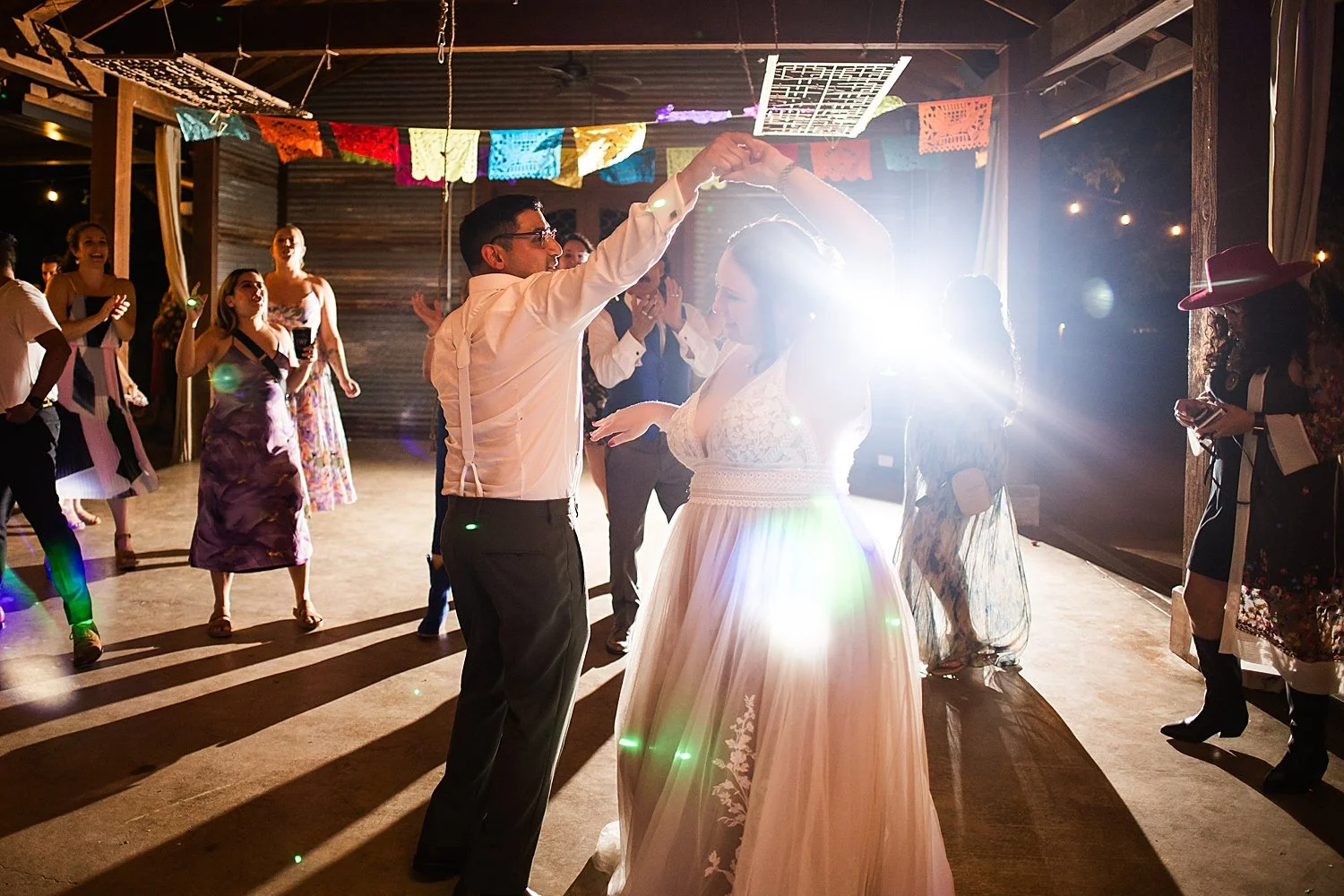 newlyweds dance on floor at reception at The Waters Point