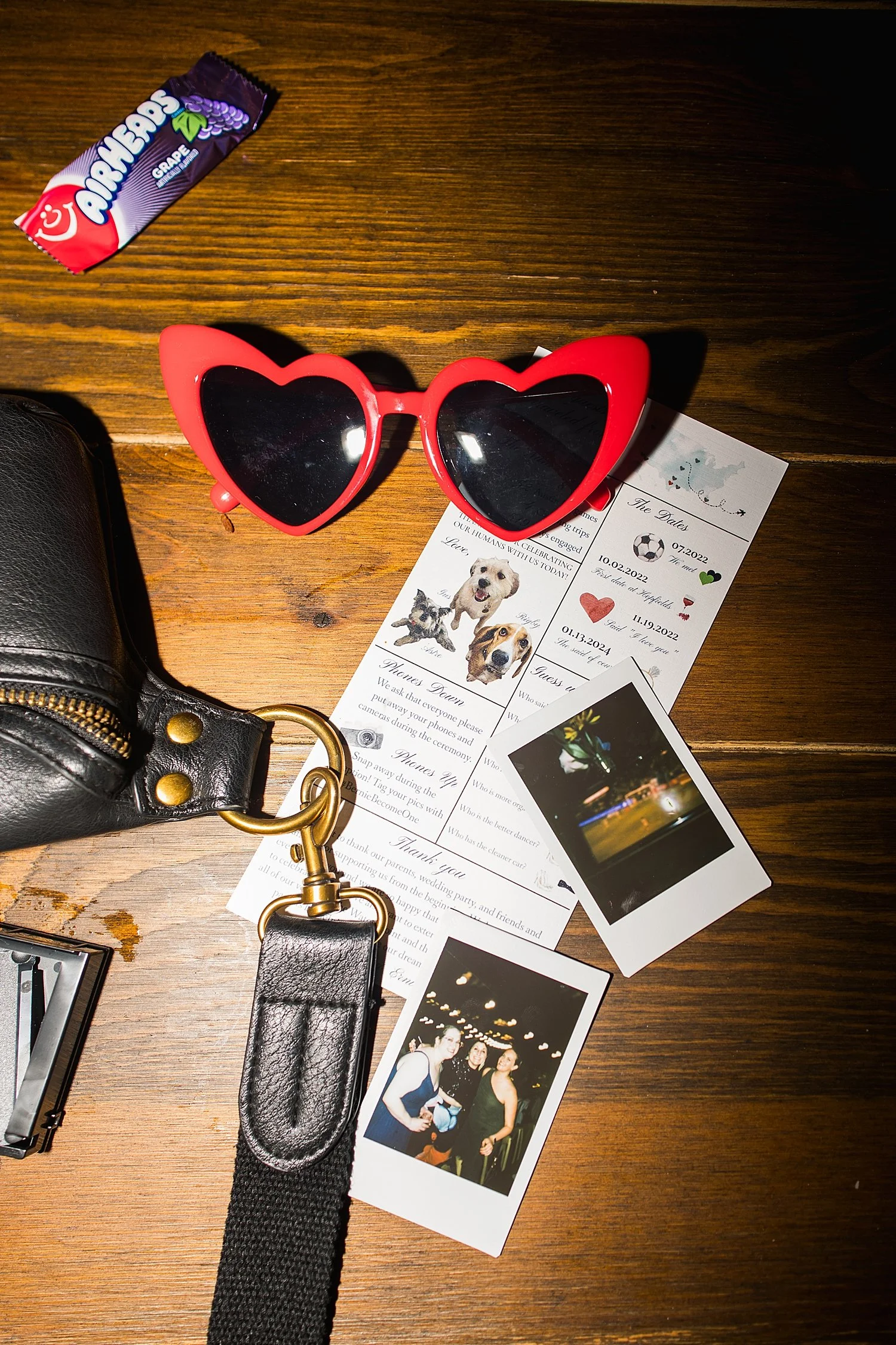 sunglasses and Polaroids on table at reception at The Waters Point