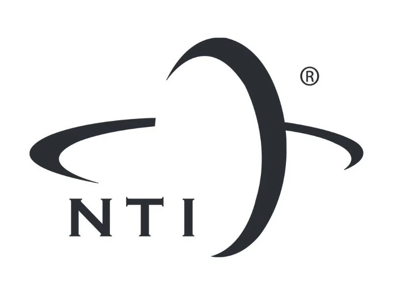 NTI logo with a stylized globe or orbit design in black and white.