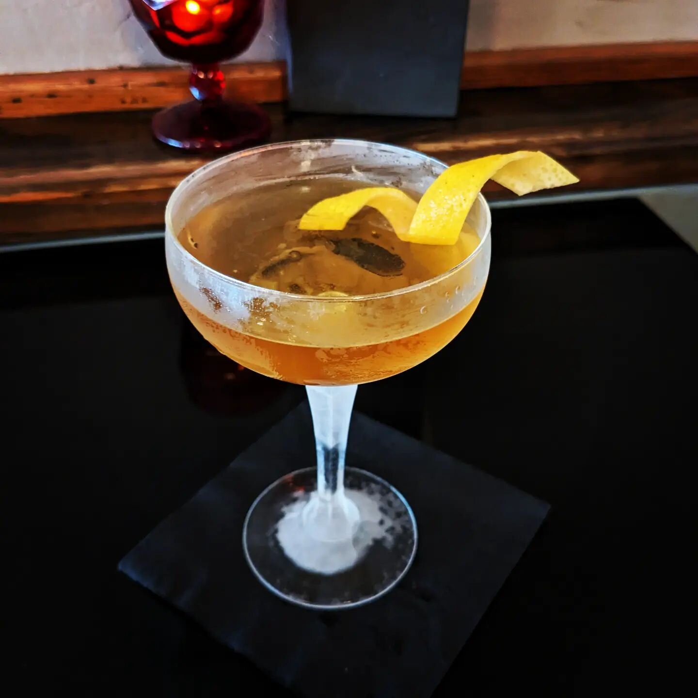 $10 Tuesday at The Dime! Experience &quot;Liminal Spaces,&quot; featuring Tullamore D.E.W. Irish Whiskey, Carpano Bianco, Chareau Aloe Liqueur, and Scrappy's Lavender Bitters. A light and floral expression of the Manhattan build.