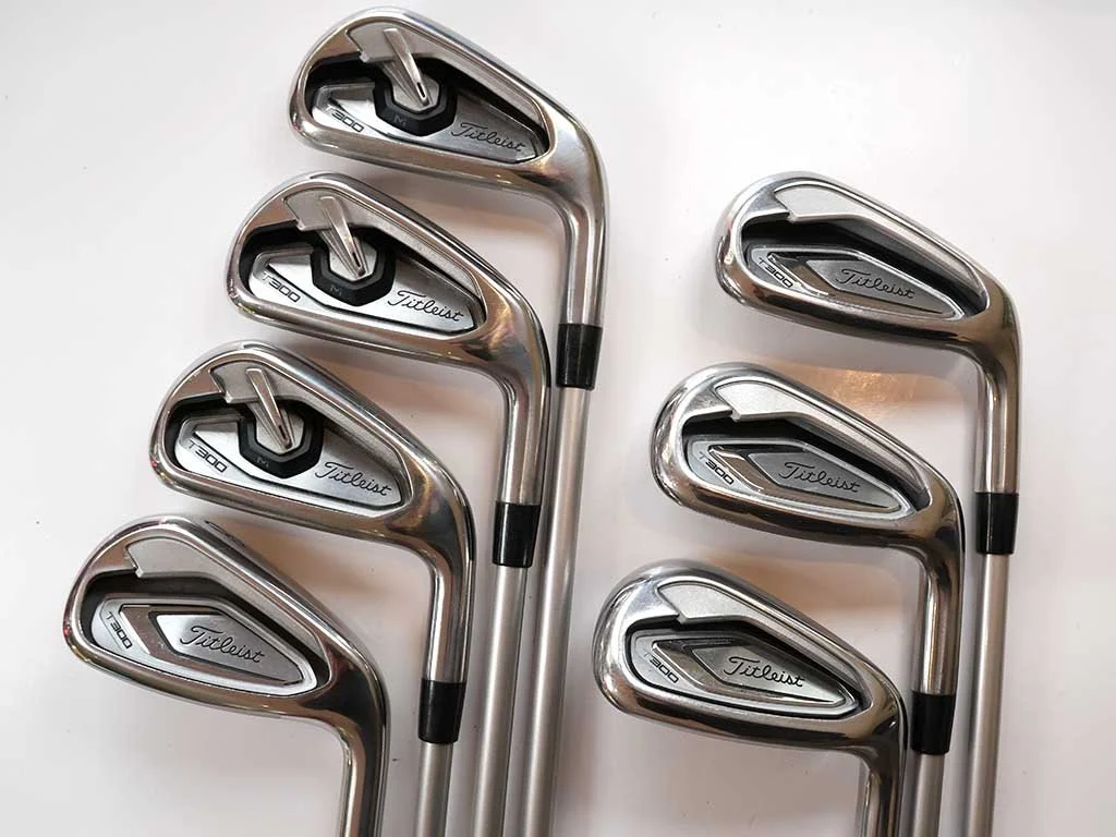 Exc. TITLEIST T300 irons 5 – PW plus 48 deg wedge w. UST iRN  A Flex graphite