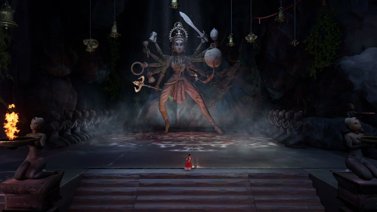 An in-game screenshot of Raji: An Ancient Epic. The character stands before an enormous statue of the Hindu goddess Durga, who has ten arms wielding the weapons of the rest of the Hindu pantheon.