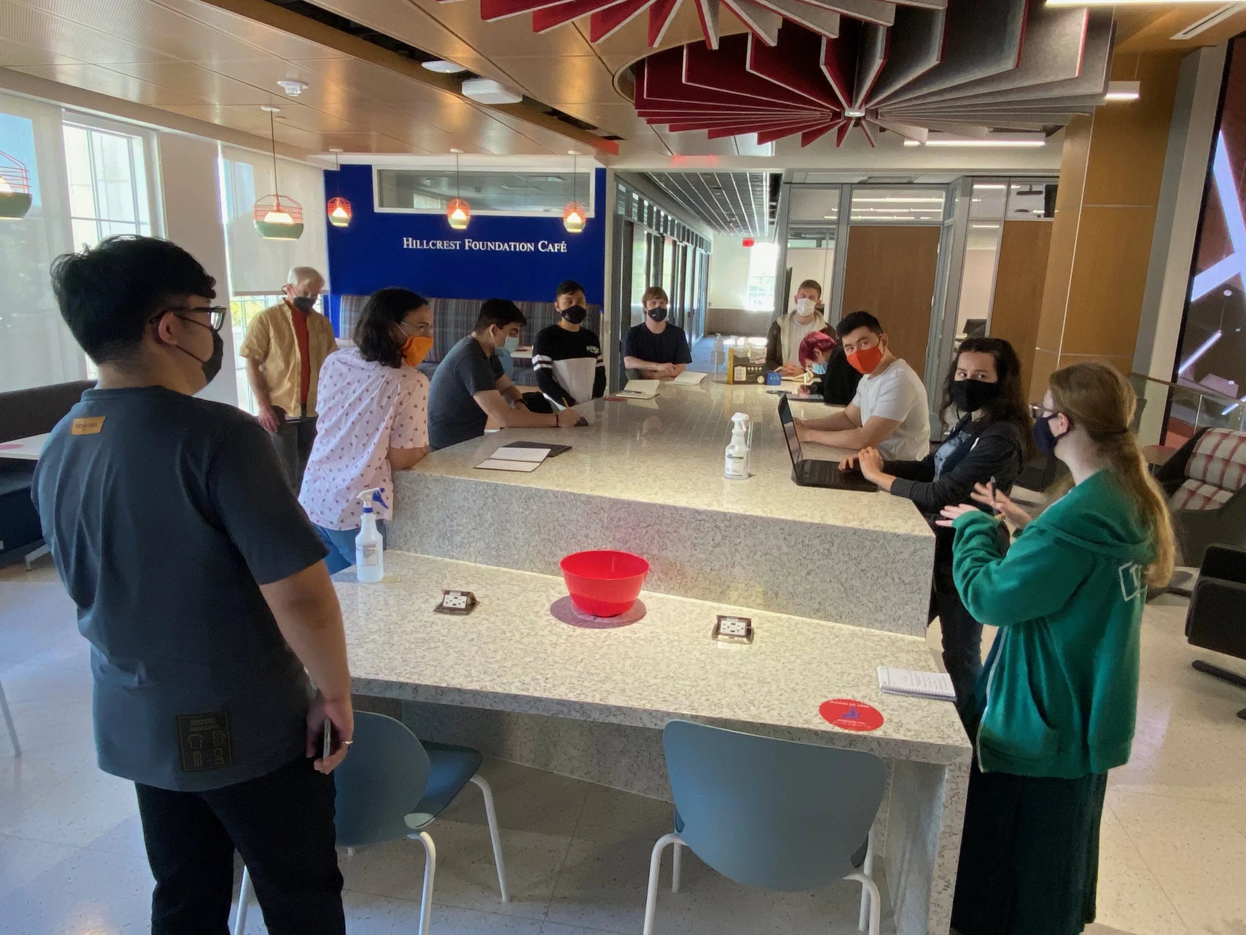 Photograph of the leads and producers meeting to discuss the day's priorities.