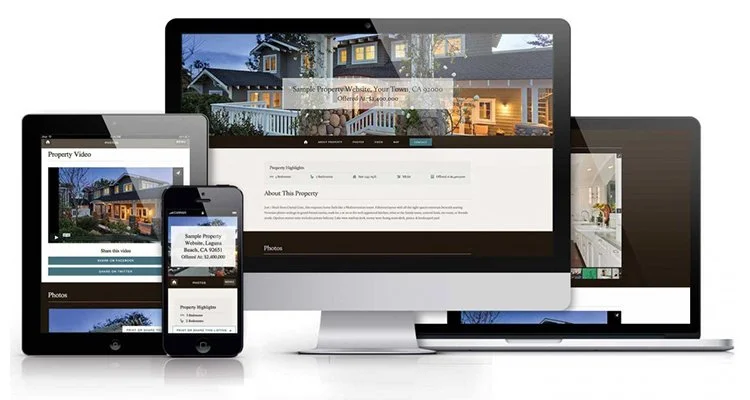 Multiple electronic devices displaying a real estate website, including a desktop computer, a tablet, and a smartphone.