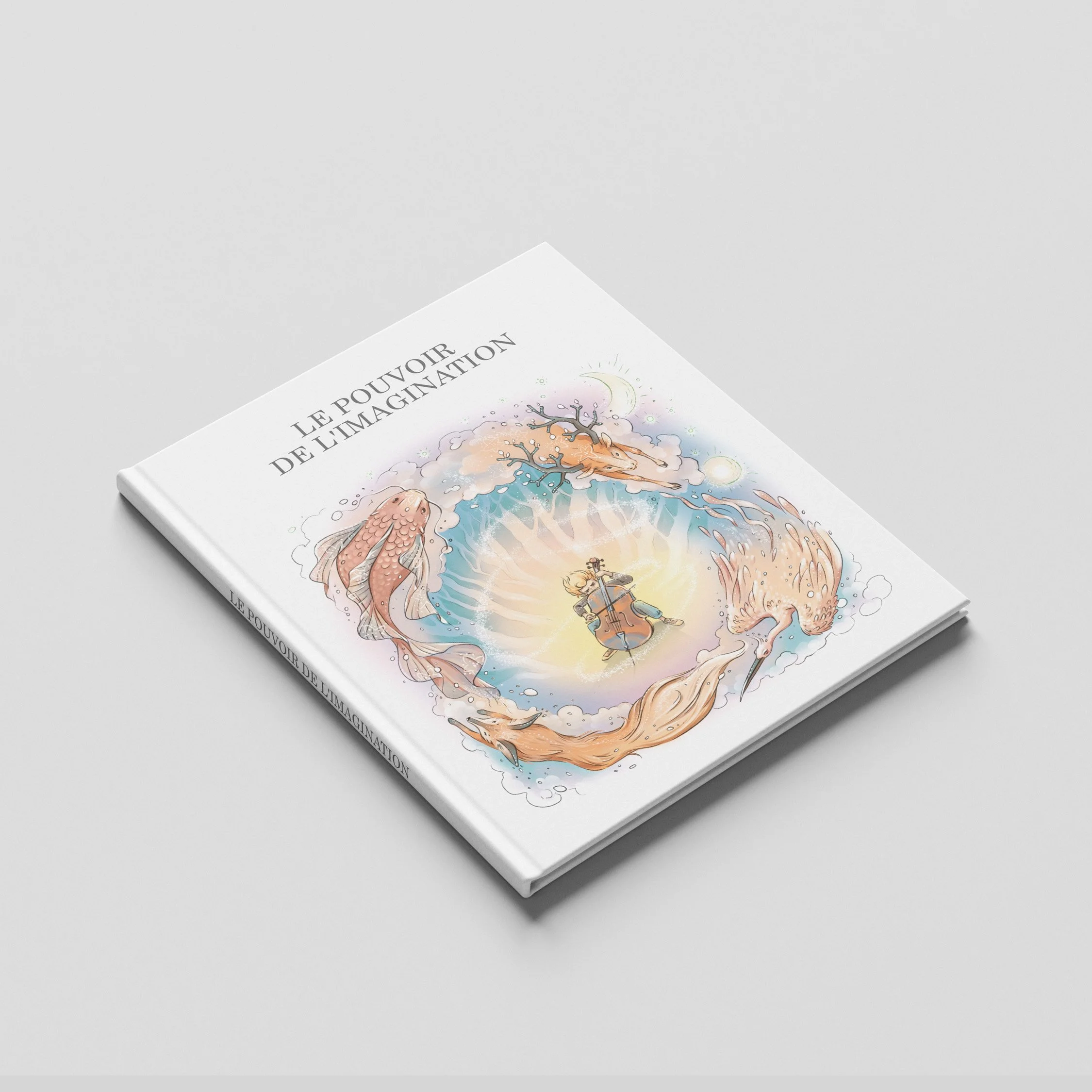 A book titled 'Le Pouvoir de l'Imagination' with an illustration of a fish, a moon, and a person playing a cello on a white surface.
