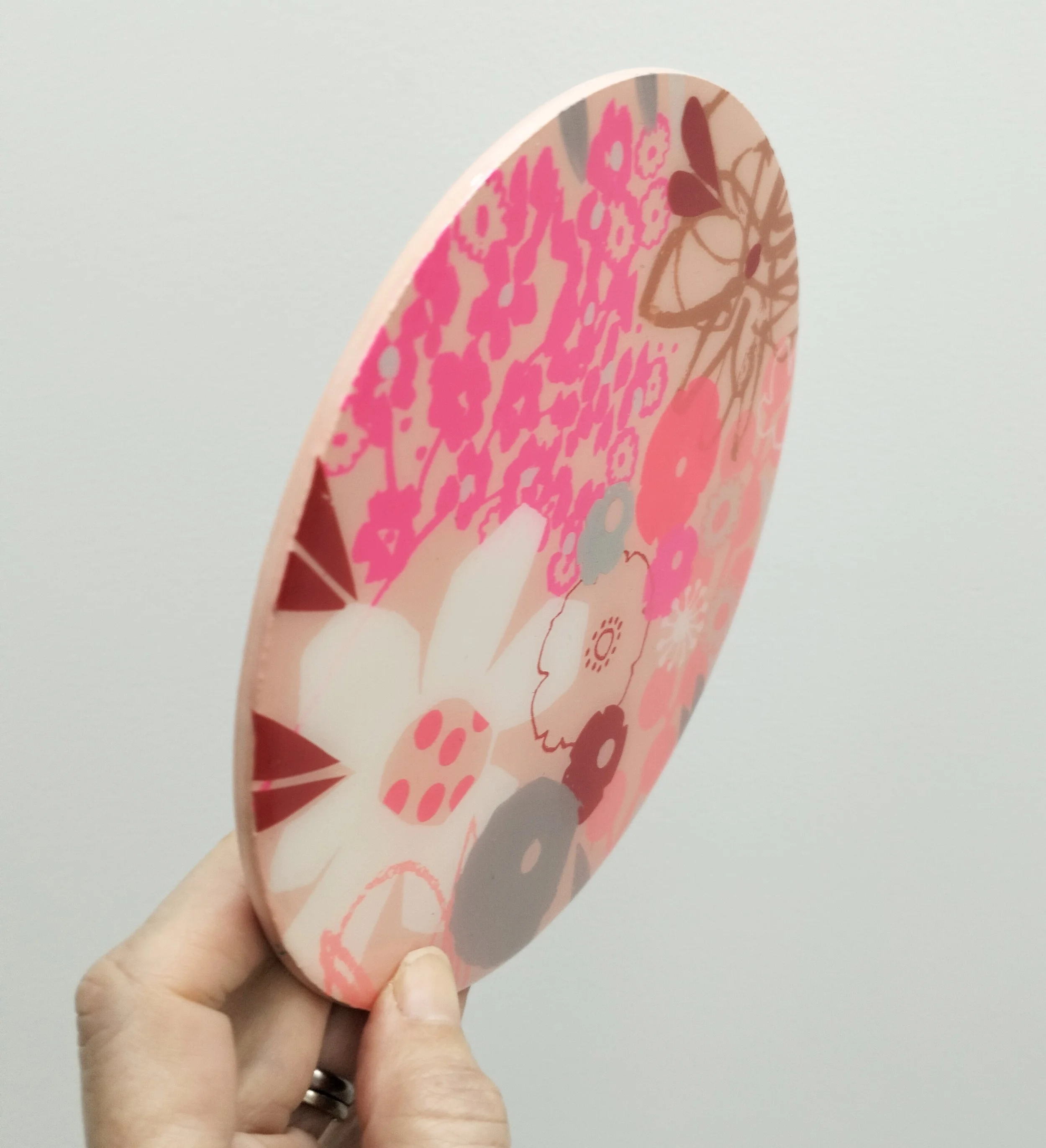 15cm round-'Peachy'-$150- screen printing, collage on wood with resin.jpg