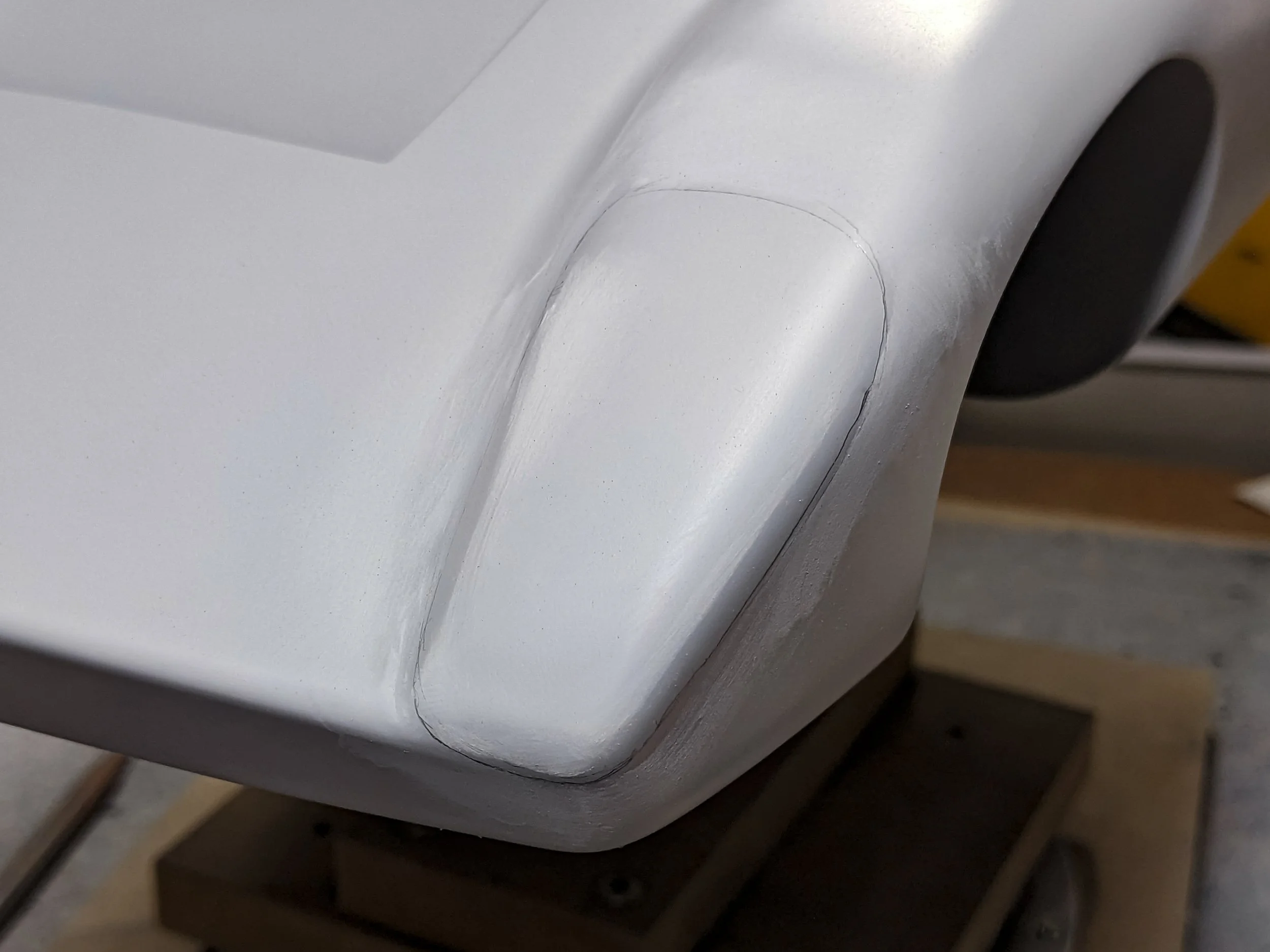 close up of earlier pencil headlight outline on Co-Hog Lola T70 restoration