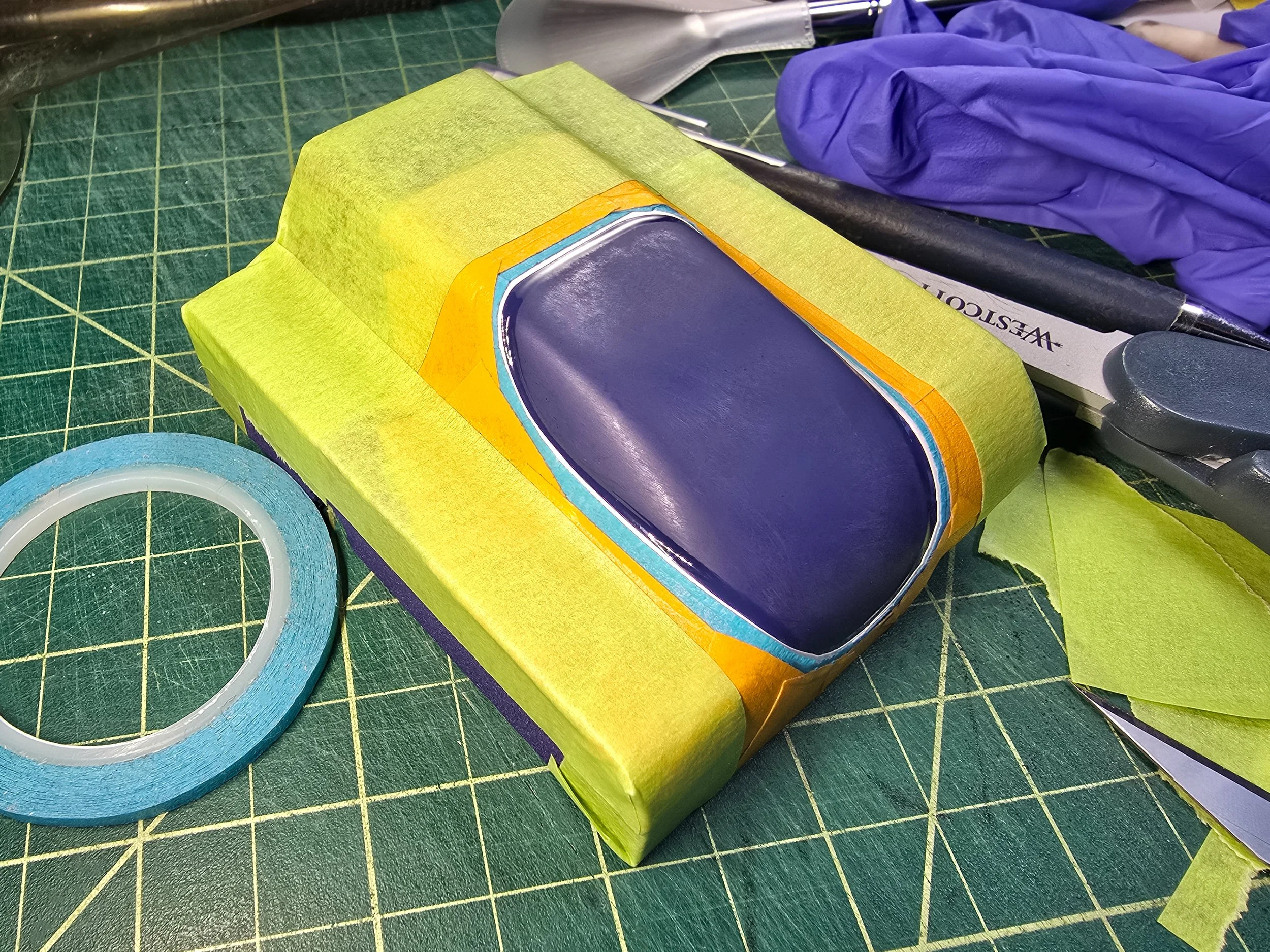 Full masking of Co-Hog Lola T70 headlight before painting