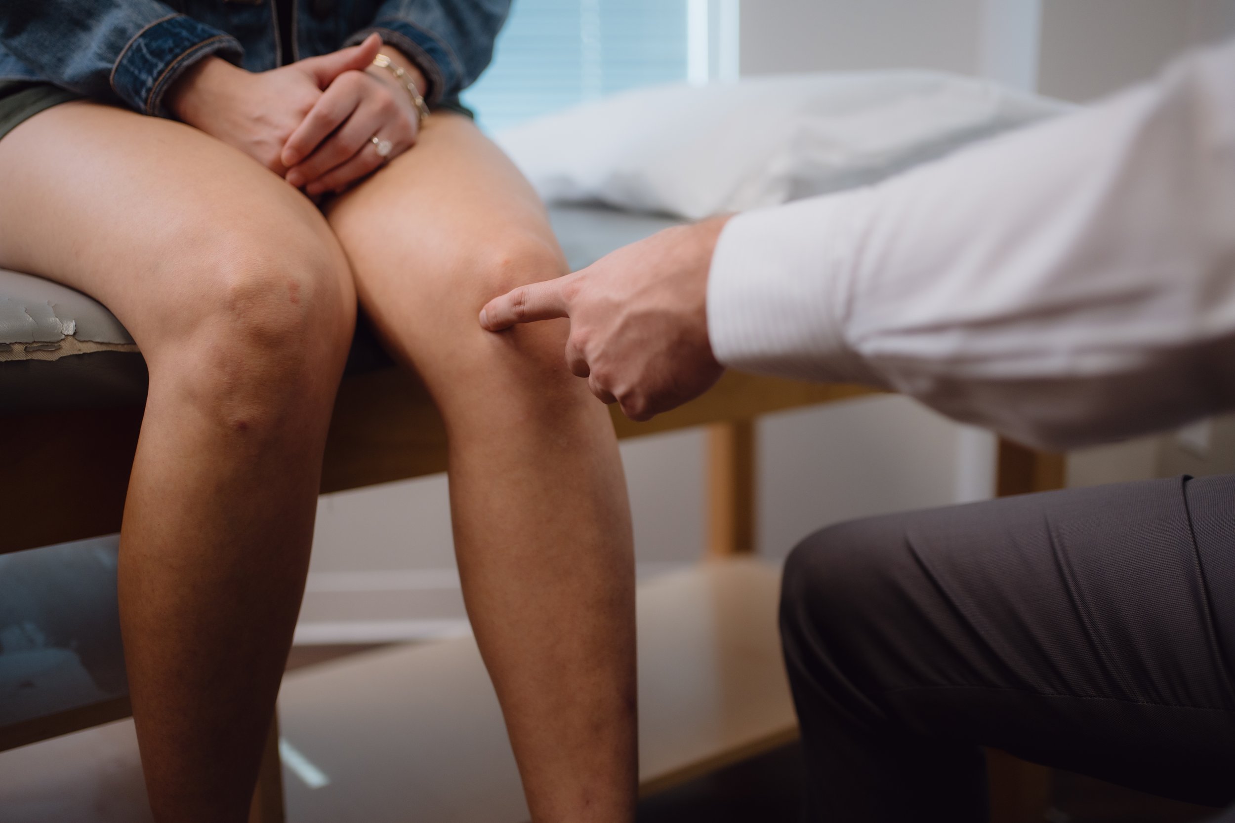 Doctor pointing to knee pain