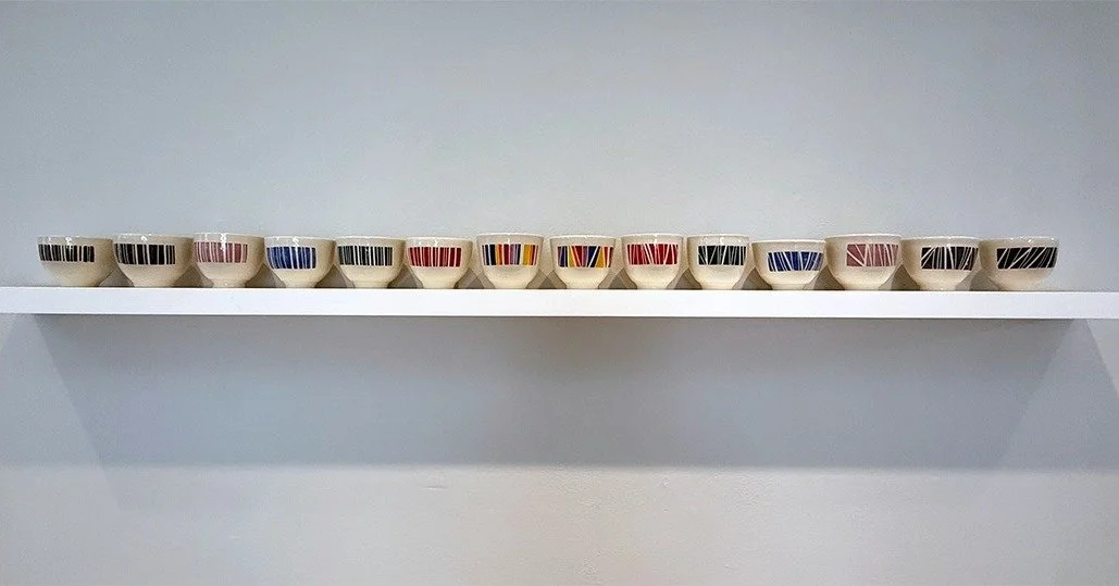 Color Musings on Imagined Barcodes 
By Lynn Cannici (Porcelain and underglazes, 2024&ndash;2025)
Shelf by Justin Farnsworth

Inspired by Barbara Jo&rsquo;s @barbarajo________ Barcode show in Somerville (2022), this work reimagines barcodes as playful