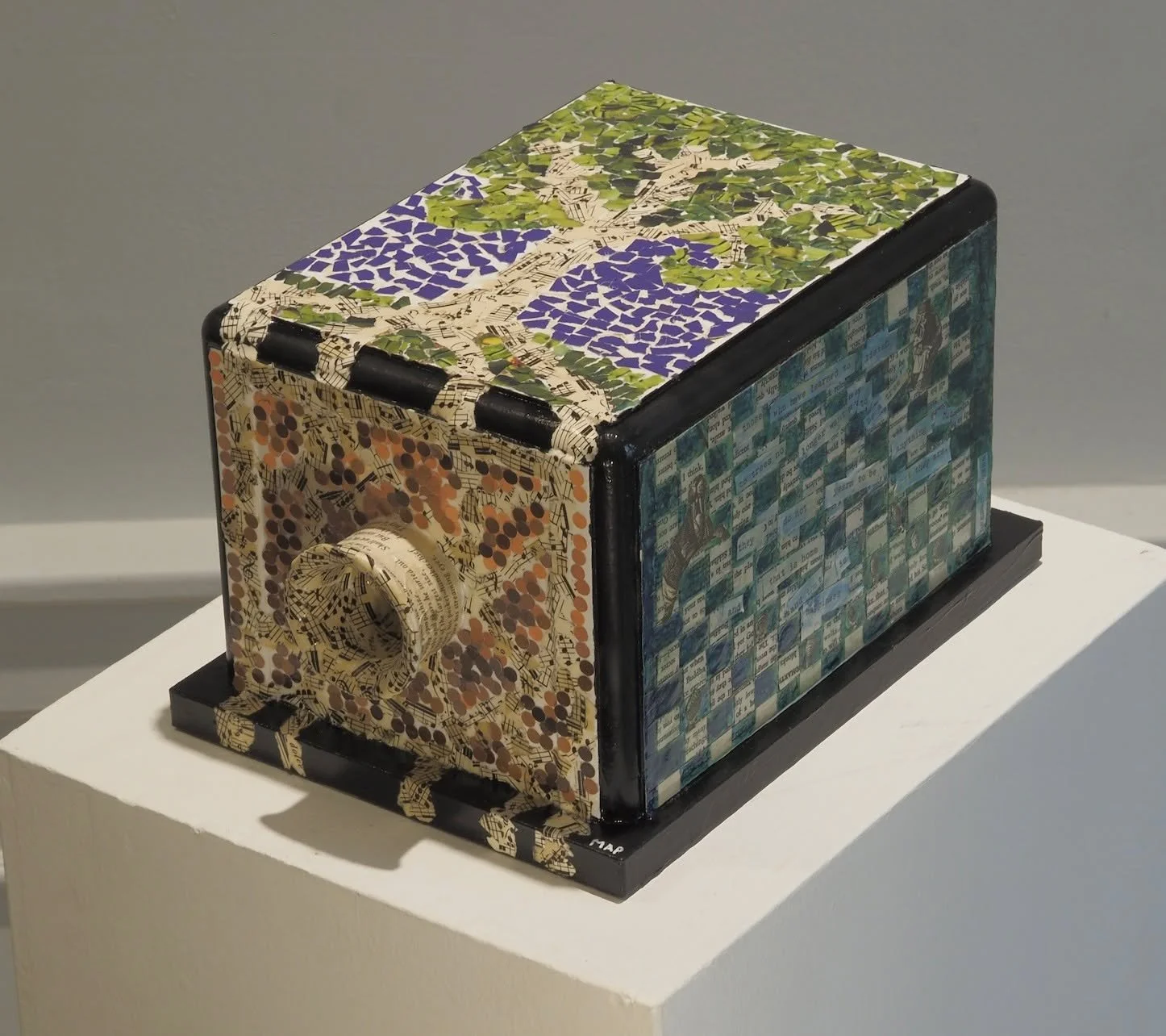 Artist Missy Arellano used mosaic paper patterns on this 3D printed replica of the world's first residential telephone as part of our Let Freedom Ring public art project. Arellano's piece was placed by Cobble Hill apartments, site of the original McL