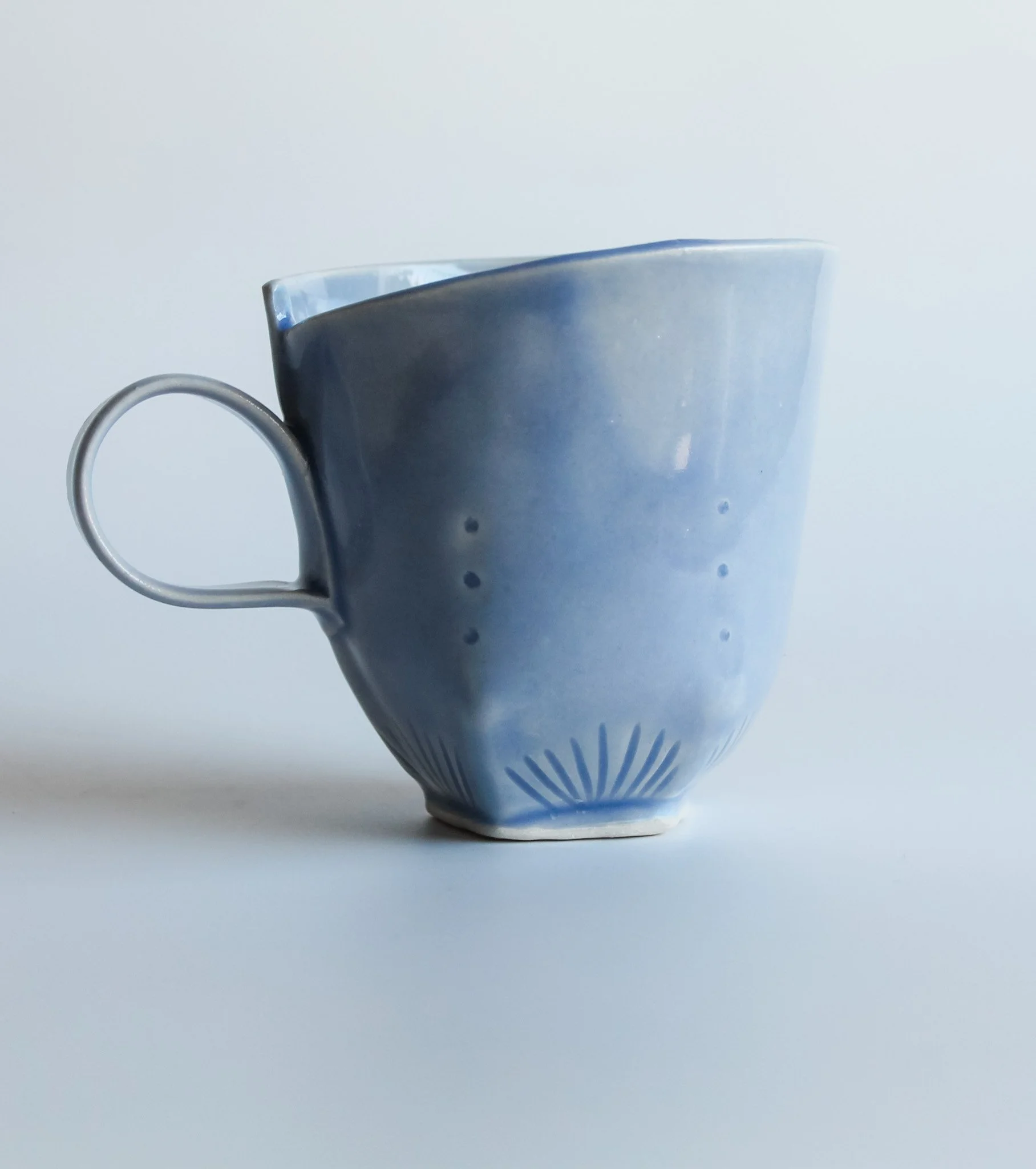Hand built blue porcelain mug with textures.