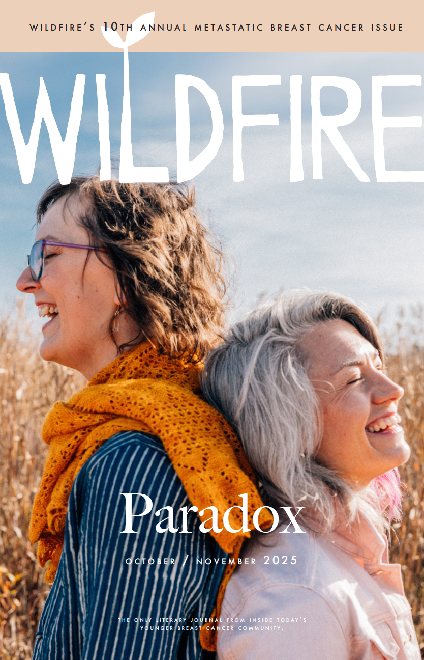 Cover of Wildfire magazine's October/November 2025 issue, featuring two women standing back-to-back outdoors in a field, smiling with closed eyes on a sunny day.