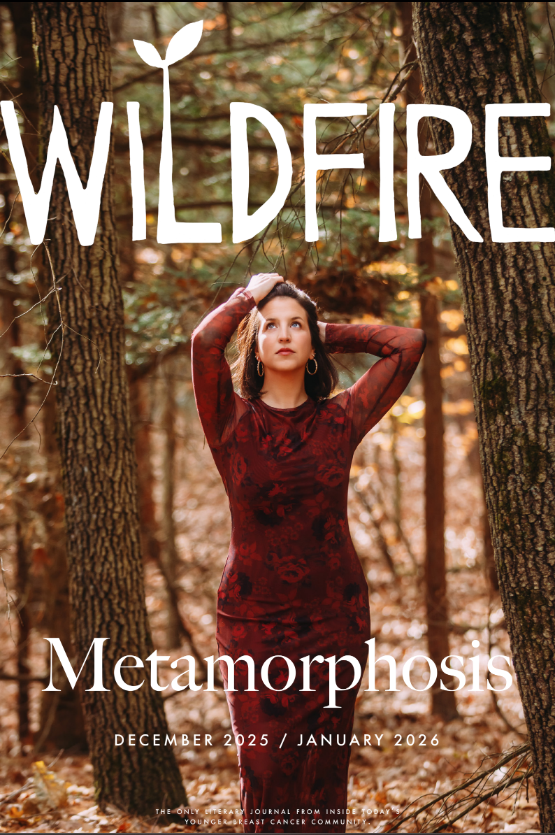 Woman in a red dress in a fall-colored forest.