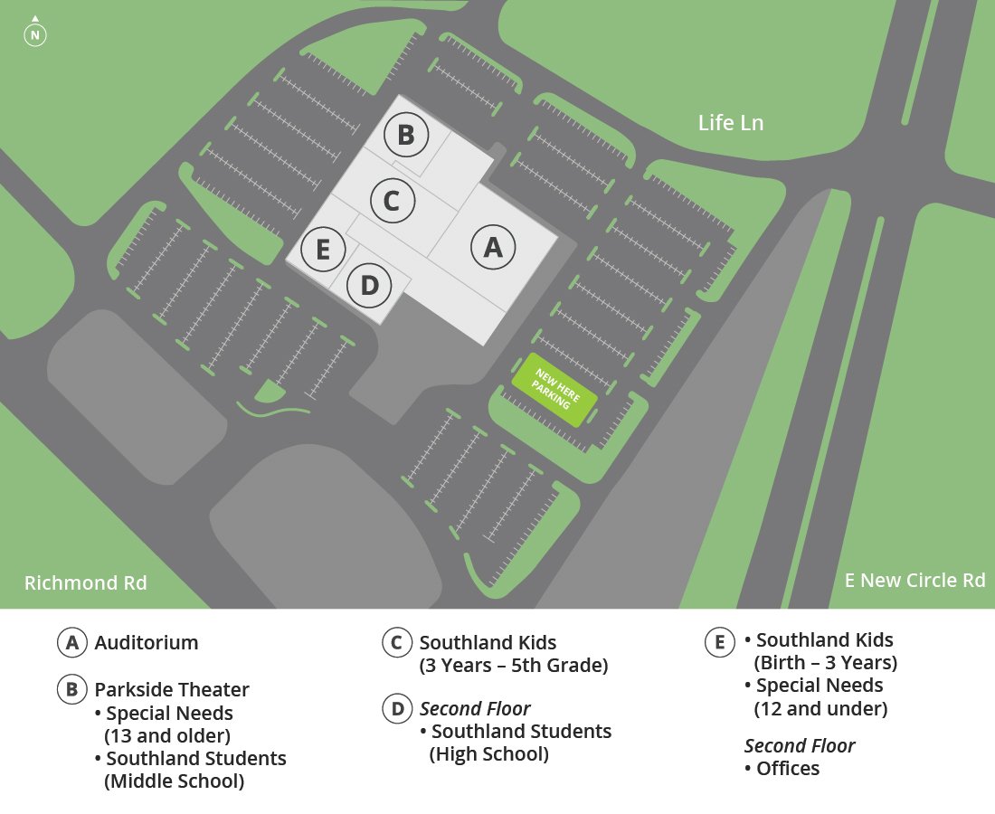 A map of a school campus showing parking lots, roads, and a building with labeled sections for auditorium, theater, and classrooms for different age groups, with surrounding greenery and a street named Life Ln.
