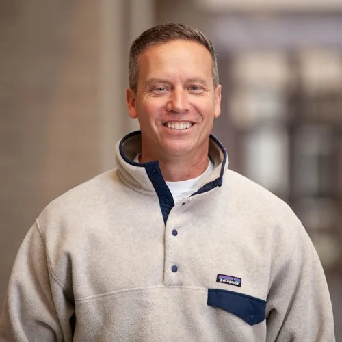 Smiling person wearing a Patagonia pullover.
