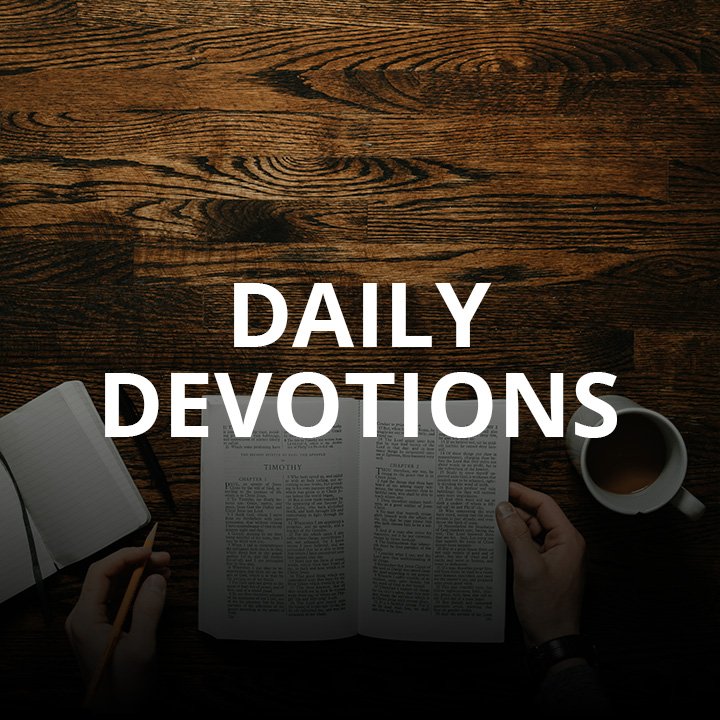 Blurry background with open book, hands holding a cup, text 'SOUTHLAND DEVOTIONALS' in focus.