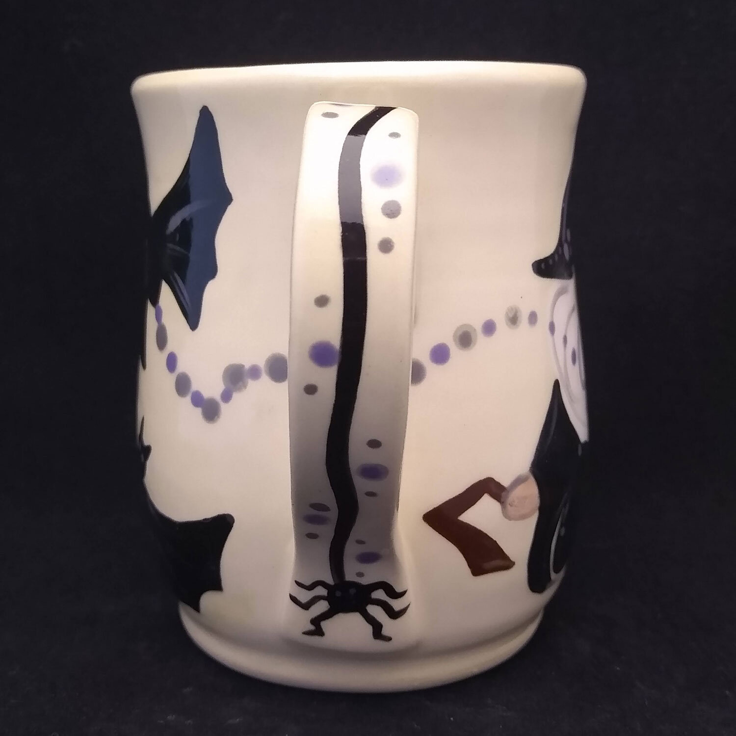 spider-dangling-on-mug-handle.jpg