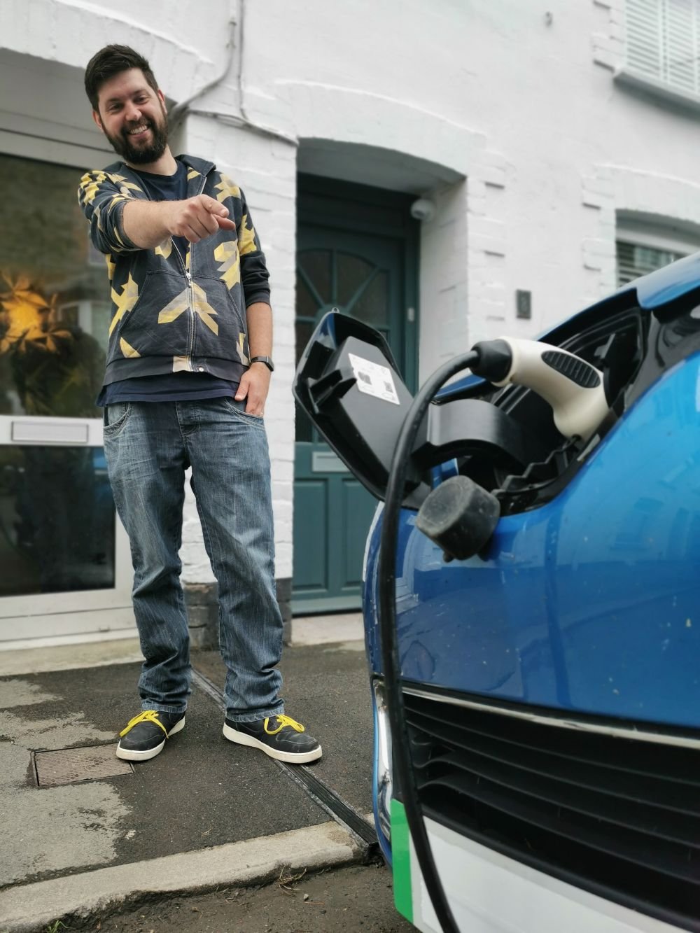 Person stood on EV cable gully while car is being charged