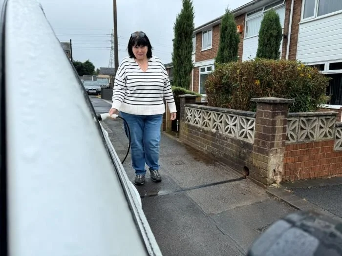 Lady charging EV with Kerbo Charge on Bolton Street