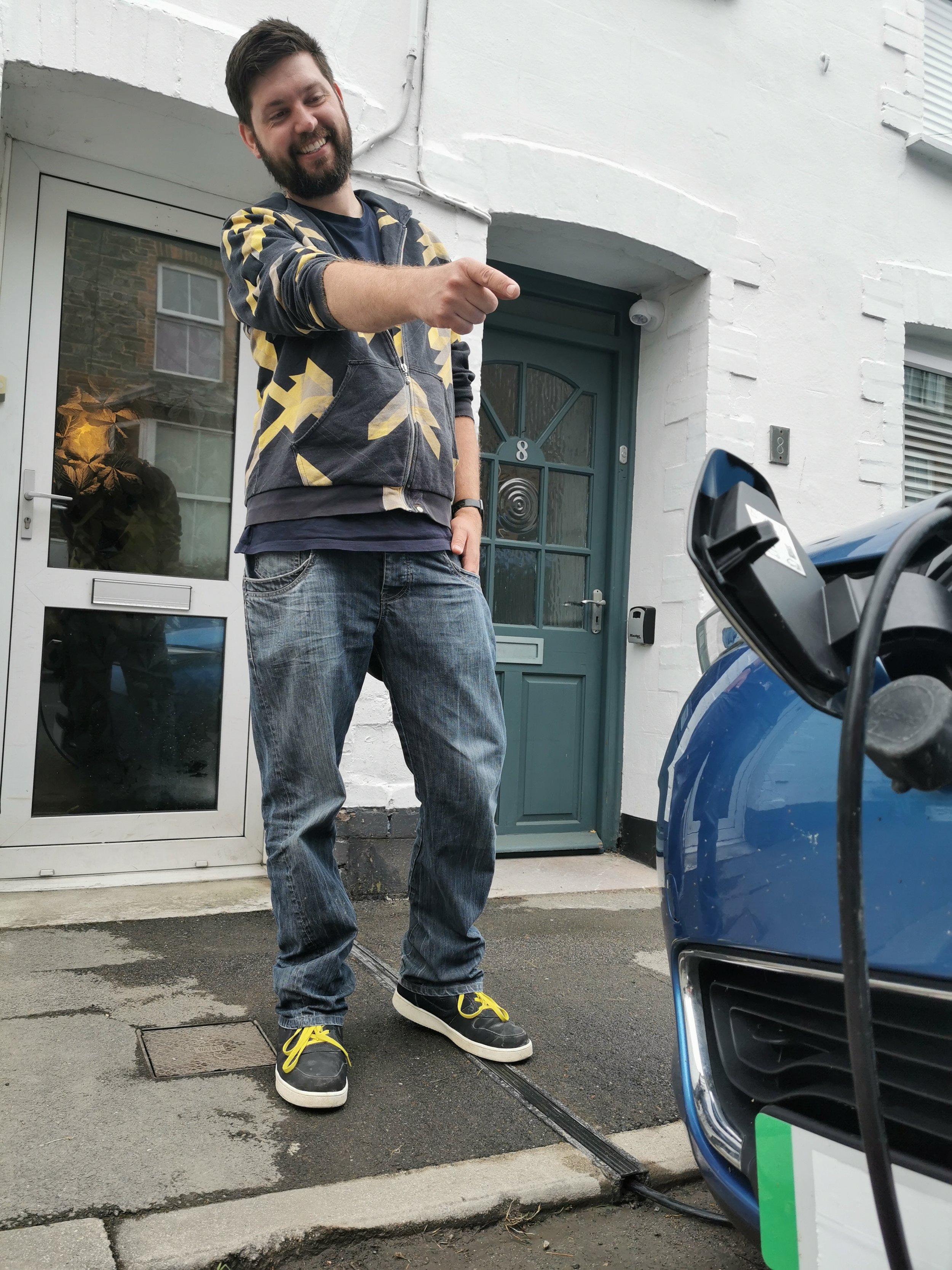 A thrilled resident who has unlocked cheap home charging in Cornwall