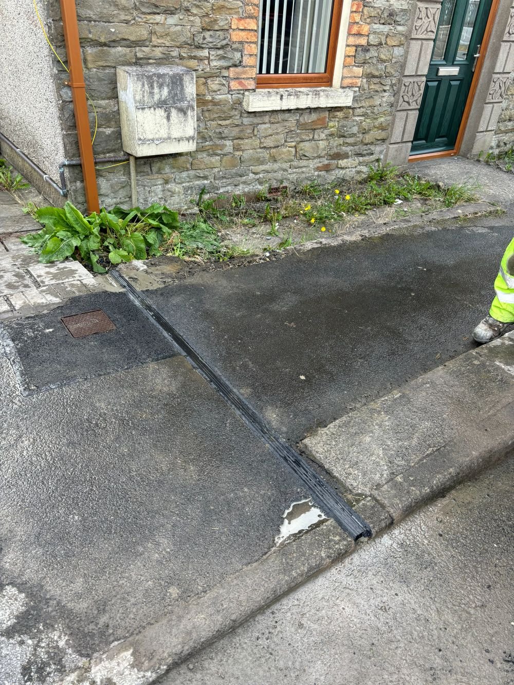 EV cable gully installation on pavement in Carmarthenshire