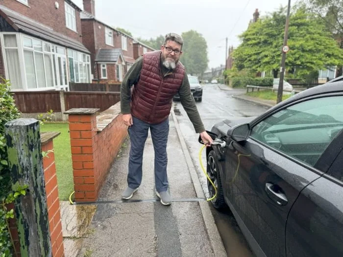 Man using EV Cable gully to charge EV on Bolton street