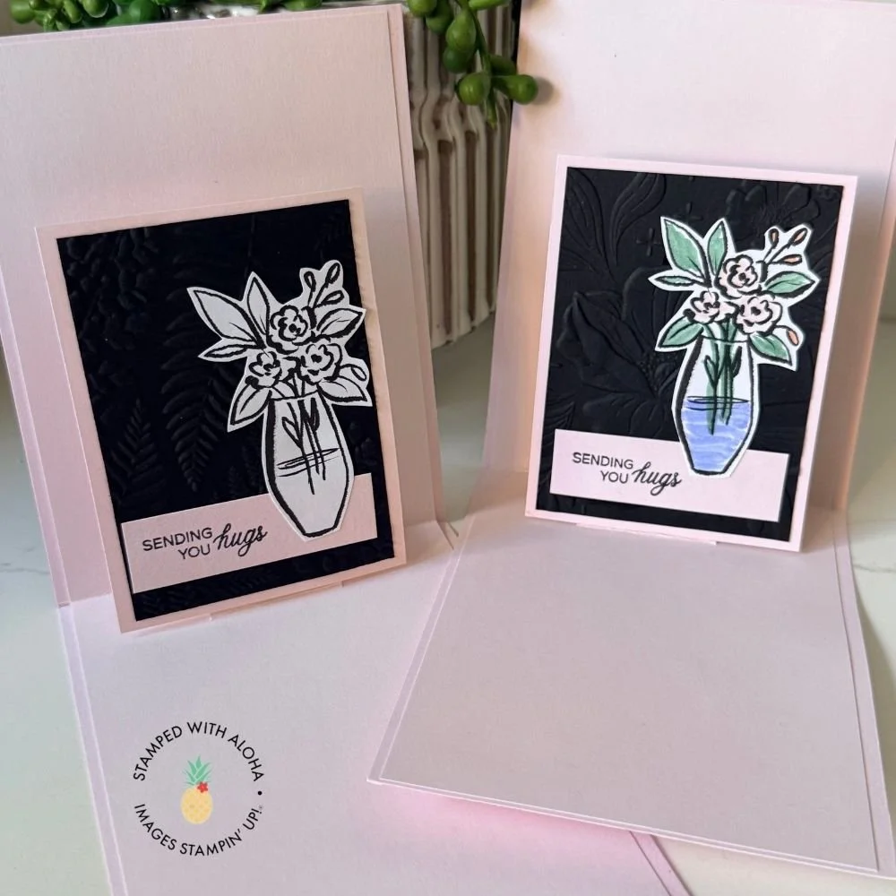 Artisan Sketched Garden pop-up card opened to reveal two raised floral vase panels with embossed black cardstock backgrounds and a Sending You Hugs sentiment.