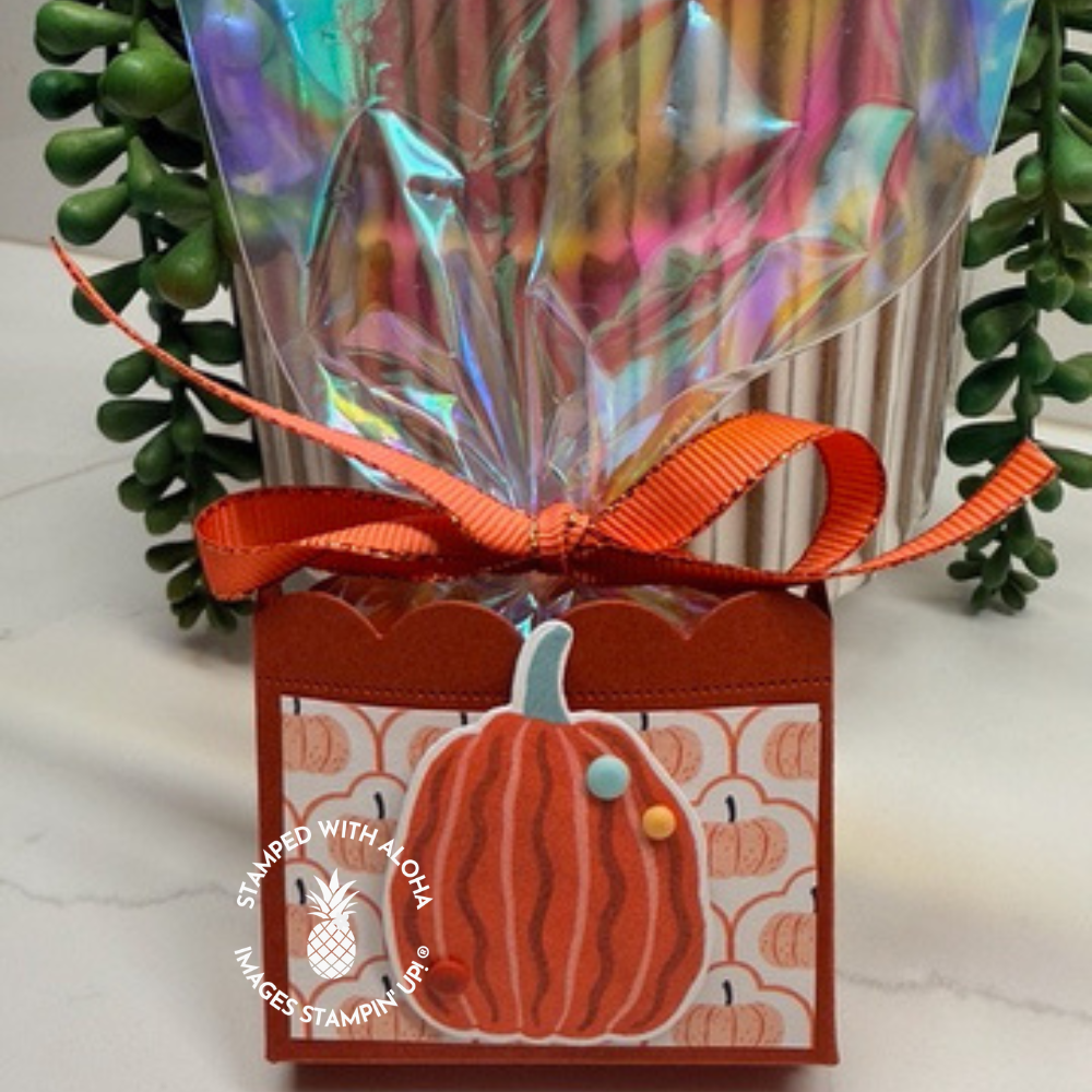 Handmade fall treat box decorated with Painted Patch pumpkin Designer Series Paper, a layered orange pumpkin, colorful embellishments, and orange ribbon.