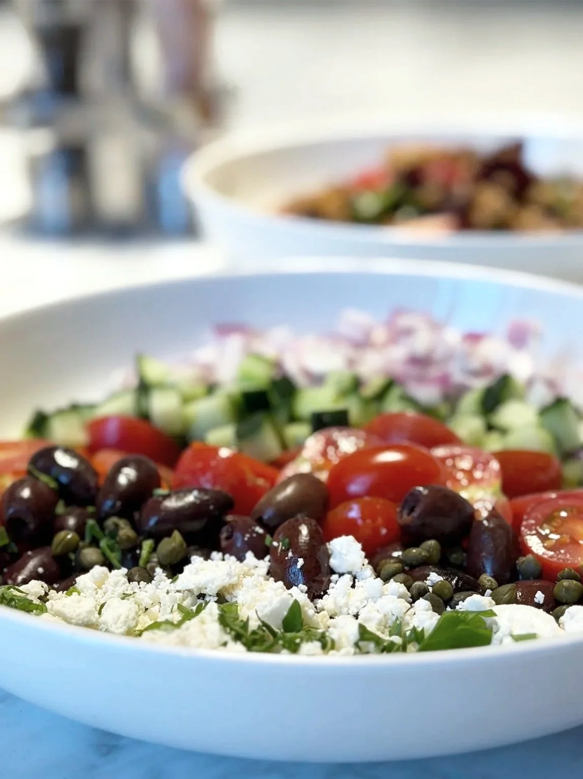 MEDITERRANEAN tomatoes, cucumbers, local Chaeban feta, onions, parsley, olives, salt-brined capers, red wine vinaigrette
