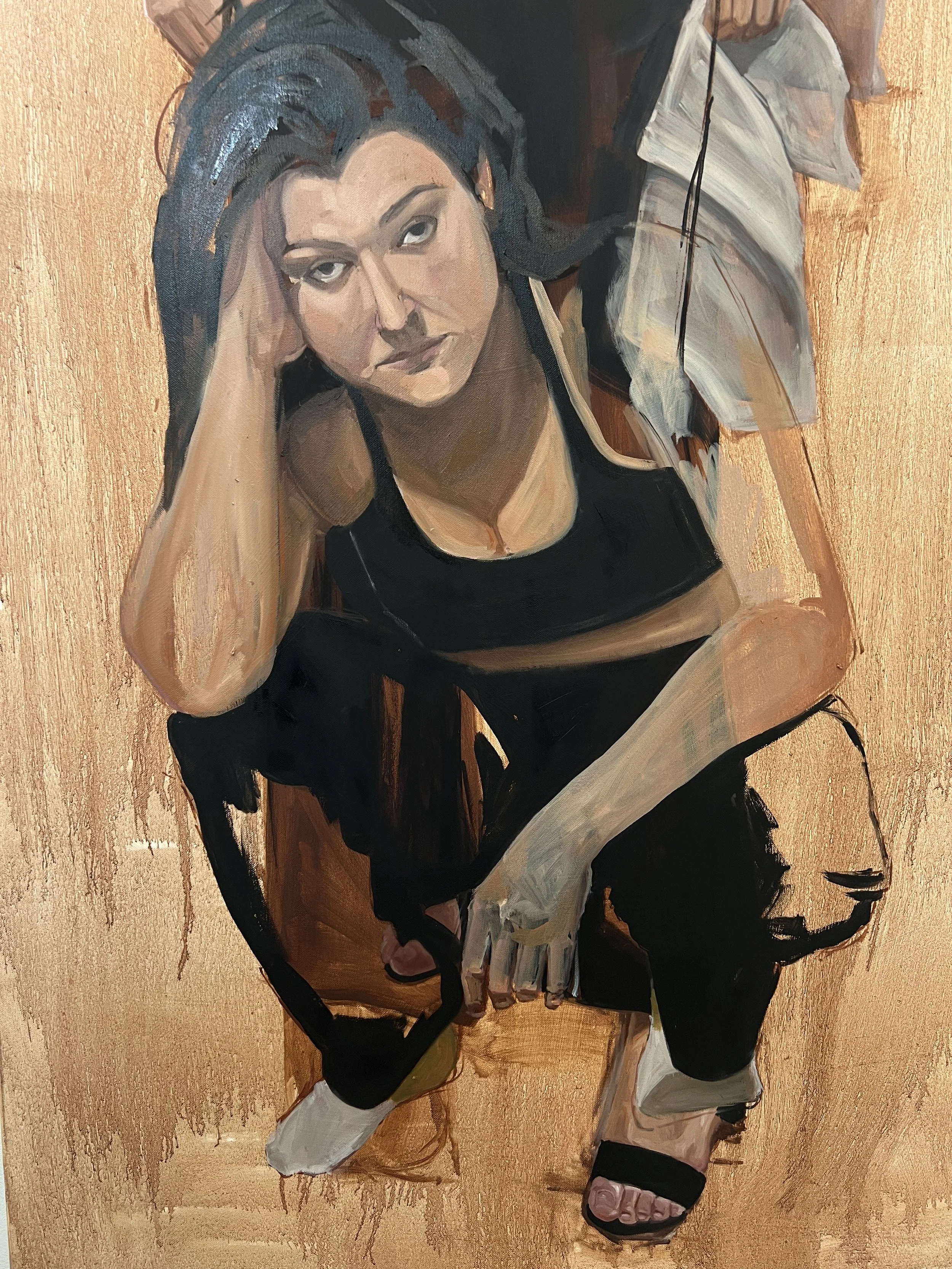 A woman with dark hair and a black tank top sitting on a chair, looking up at the camera with a serious expression, in a painted portrait.