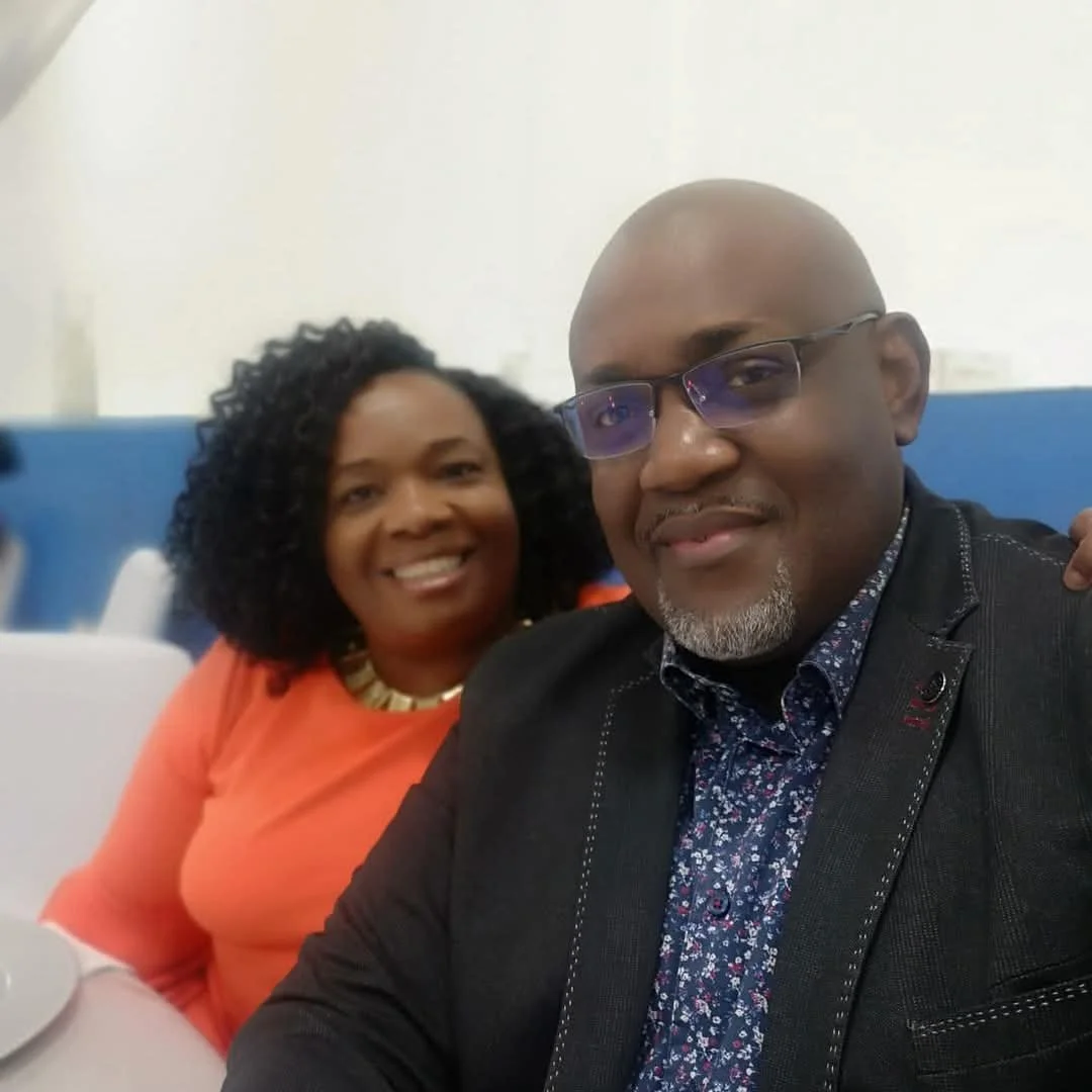 Lead Pastors Devon and Patricia Wright, founders of Worship in the House, smiling together.