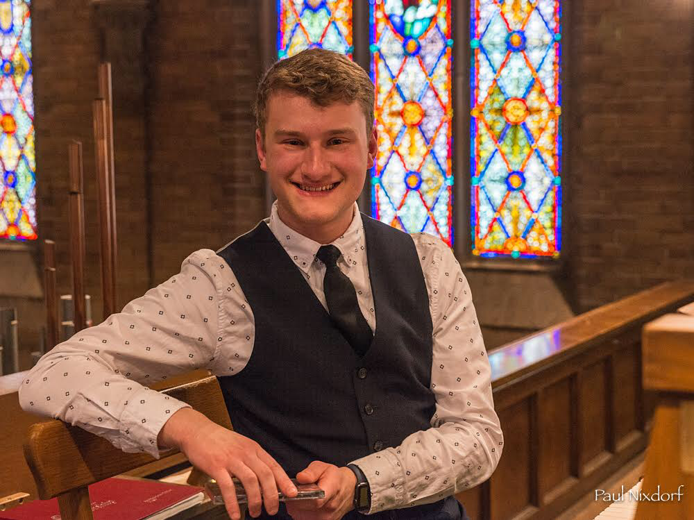 Parker MacIver Hinnenkamp at the console of the Schlicker organ in Mount Olive Lutheran Church in Minneapolis, Minnesota. Photo by Paul Nixdorf.