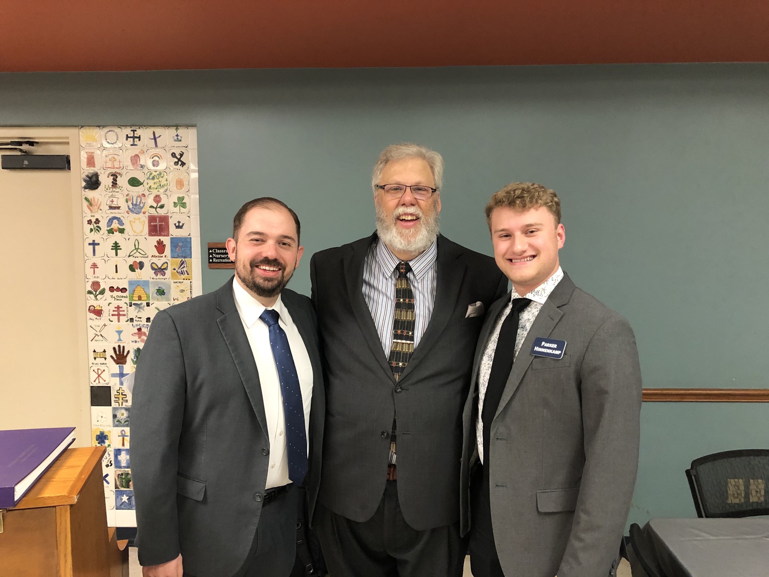 Parker MacIver Hinnenkamp with Dr. Joshua Taylor (left) and Dr. Jeffrey Snider (center).