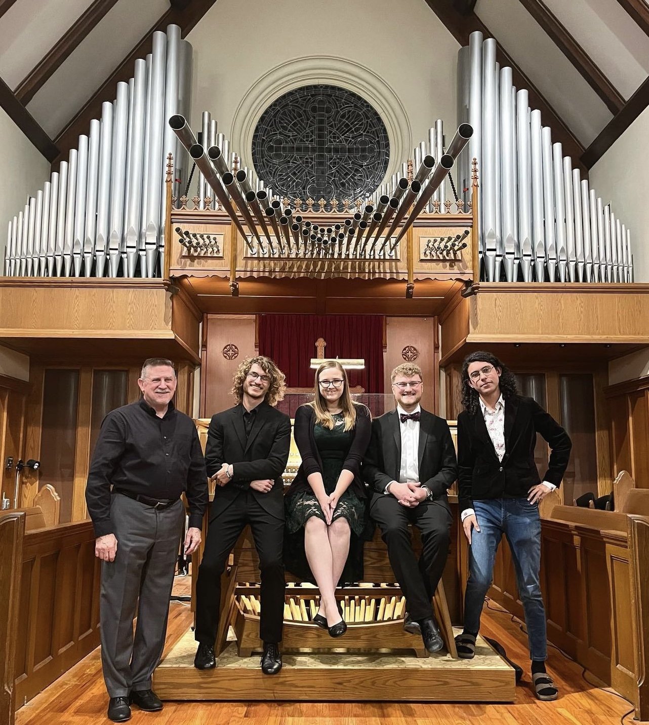 Parker MacIver Hinnenkamp and colleagues at the console of the Casavant organ in St. Andrew Presbyterian Church in Denton, Texas, before a recital as part of the Dallas Chapter of the American Guild of Organists' Neighborhood Recital Series.