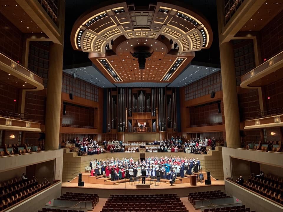 Parker MacIver Hinnenkamp on the stage in the Meyerson Symphony Hall in Dallas, Texas before a mass choir performance with members of the Church Music Institute. Dr. Eric Nelson, conductor and Bradley Hunter Welch, organ.