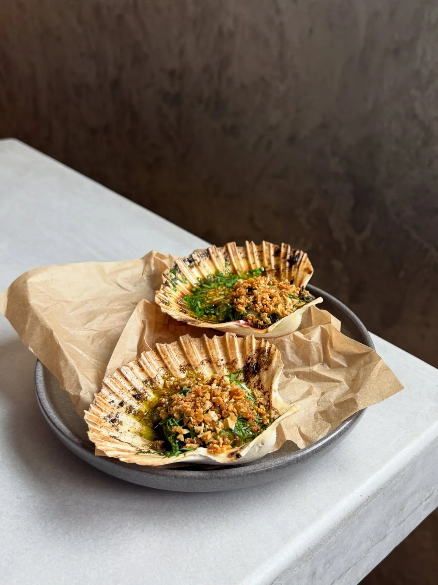 Roast WA scallop, herb butter, almond crunch. 

On this week&rsquo;s $10 Happy Hour menu, from 5-6PM Wed-Fri and 3-5PM Sat.