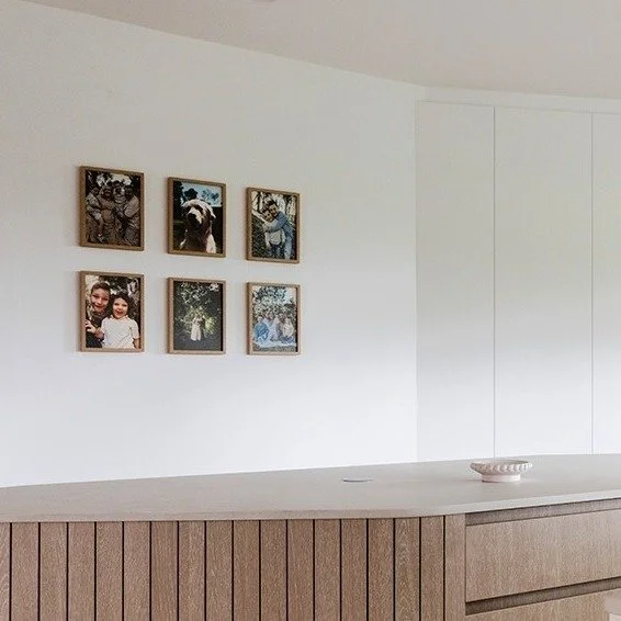 KEILOR HOUSE.

The unique kitchen layout was designed to hug the perimeter of the existing envelope, enabling the insertion of a considered angled wall to house appliances and a concealed walk-in pantry. These actions informed the island benches bold