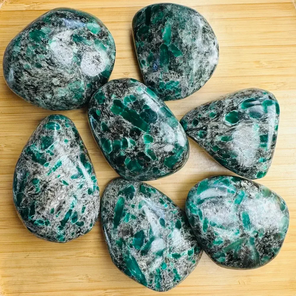 Natural rough and tumbled emerald crystals for jewelry, decor, and energy work