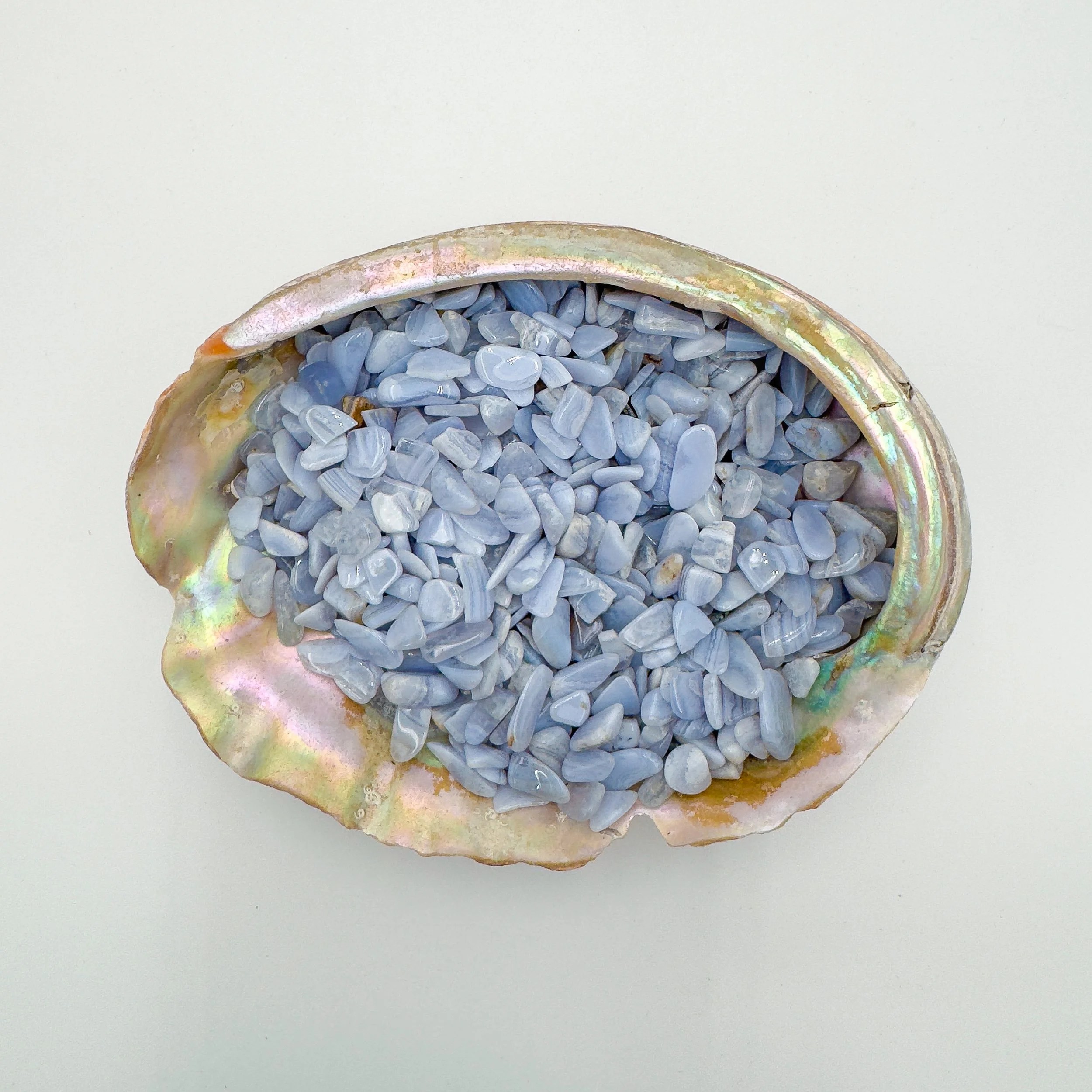 Blue Lace Agate chips with soft blue and white banding, polished and tumbled for jewelry making, resin art, meditation jars, and decorative use.