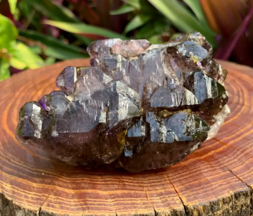 Ethically sourced smoky amethyst crystals from Zimbabwe, combining purple quartz with deep smoky brown tones.