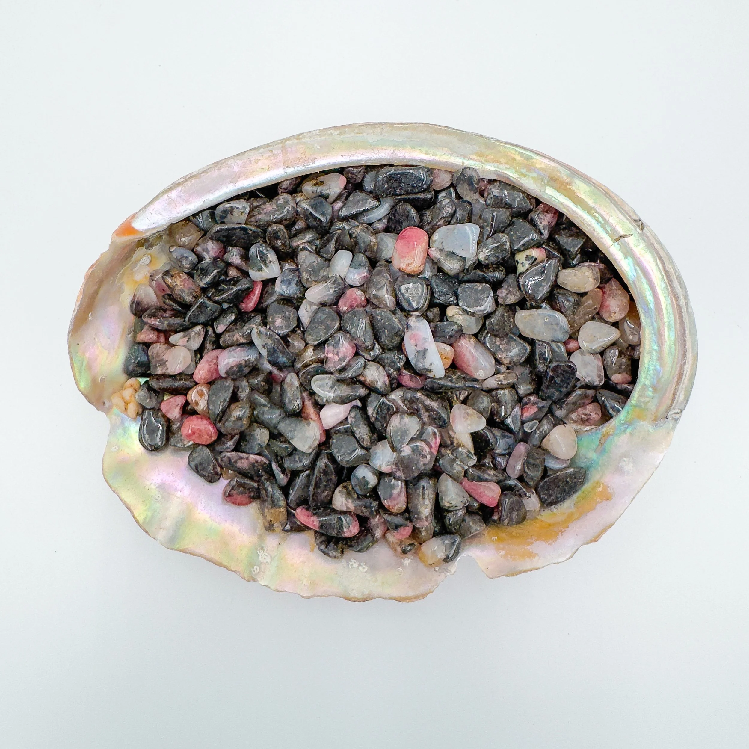 Bulk Rhodonite crystal chips – polished tumbled gemstone pieces in natural pink and black tones, ideal for crafts, décor, jewelry making, and healing energy work.
