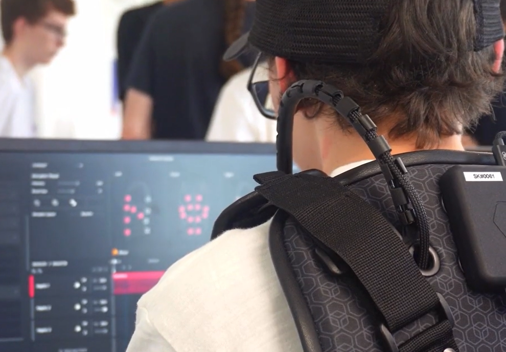 User wearing a Skinetic vest creating a haptic effect in Unitouch Studio