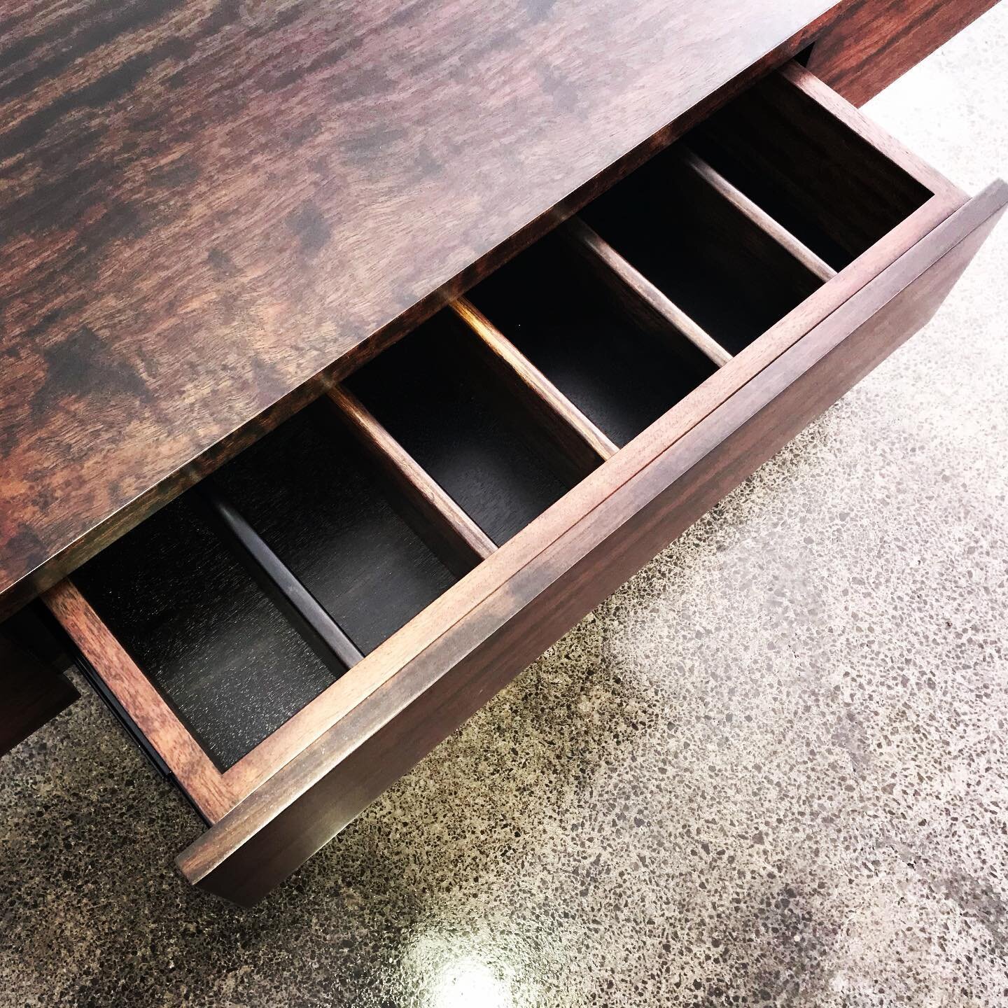 The mix of mediums adds to this very simple yet functional African Rosewood sideboard.

Our client was wanting a contemporary designed sideboard that matches their dining table. It also needed to store their cutlery, placemats and other dining access